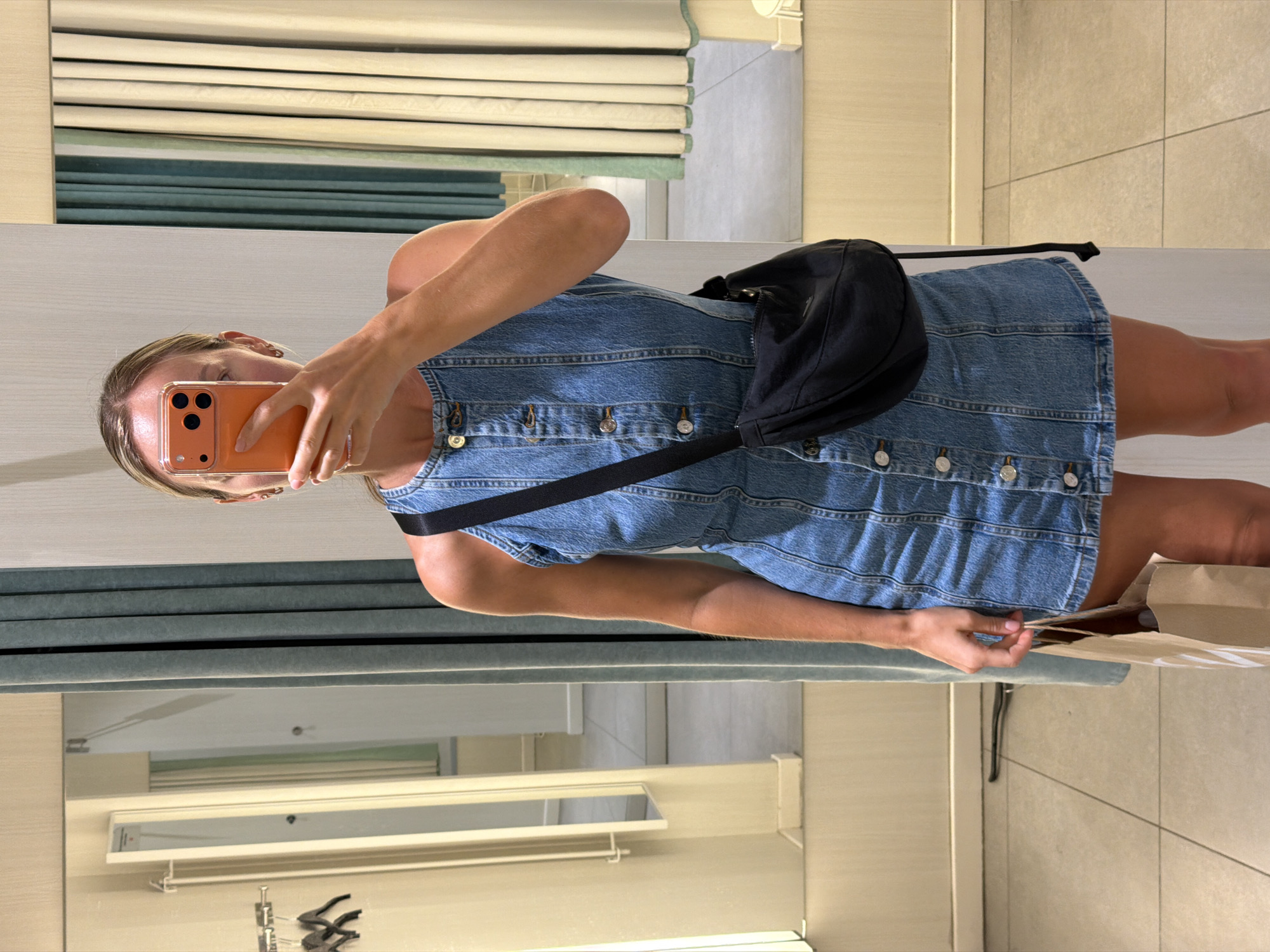 Trying on denim at a Mango store in coastal Spain