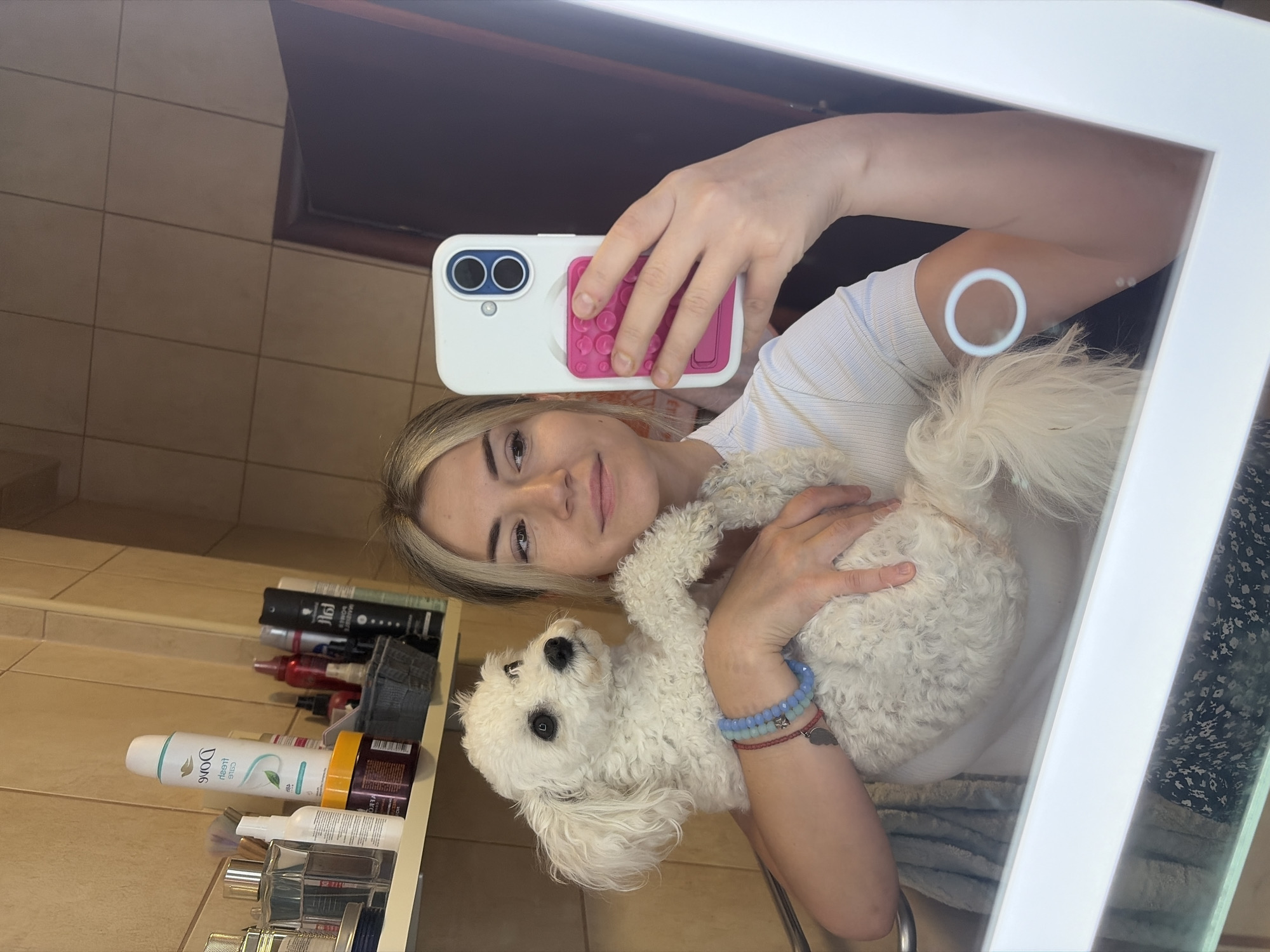 Mirror selfie with a white poodle in Budva