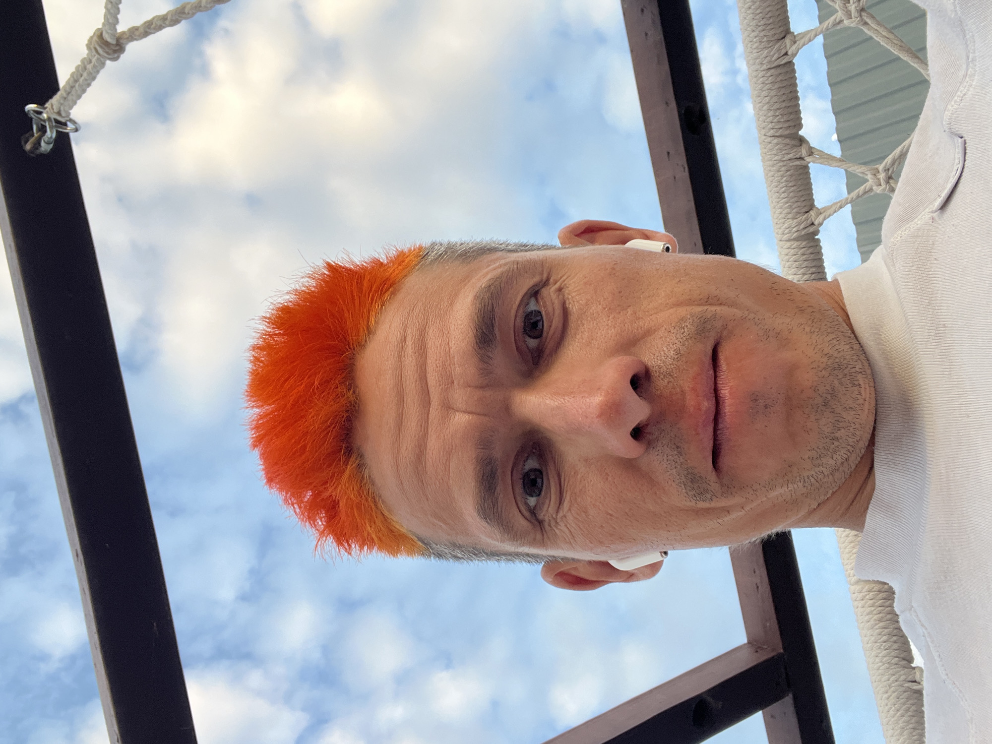 Orange-haired individual captures evening moments with cat in Chaikovsky