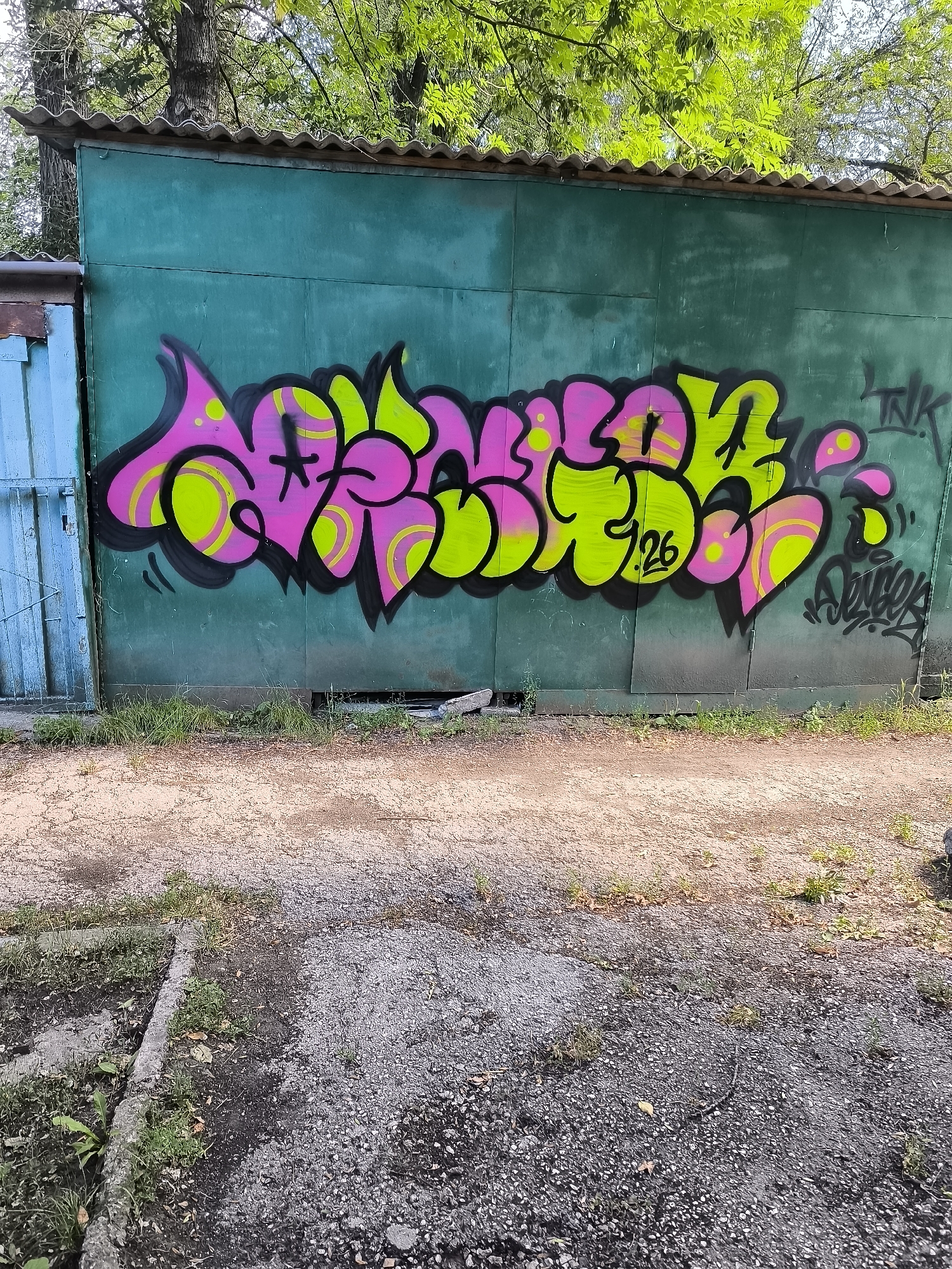 Graffiti-tagged garages and Soviet-era signage in Bălți, Moldova