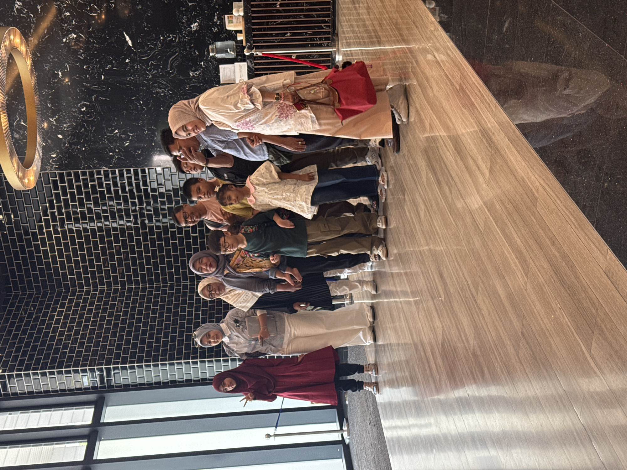 Family layover in Kuala Lumpur — lobby, coffee, and kids