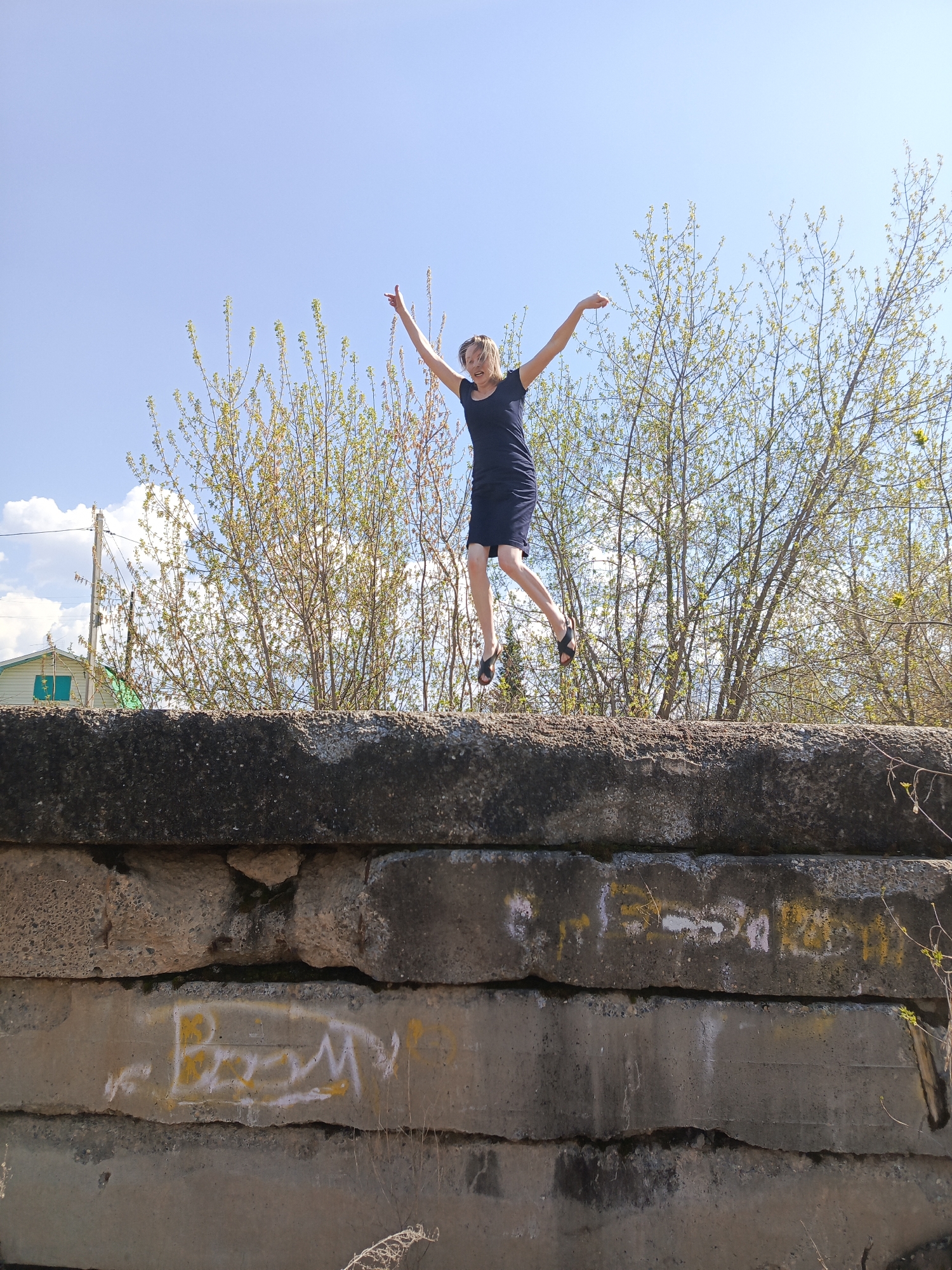 Woman photographed during riverside outing in Chaikovsky, Russia