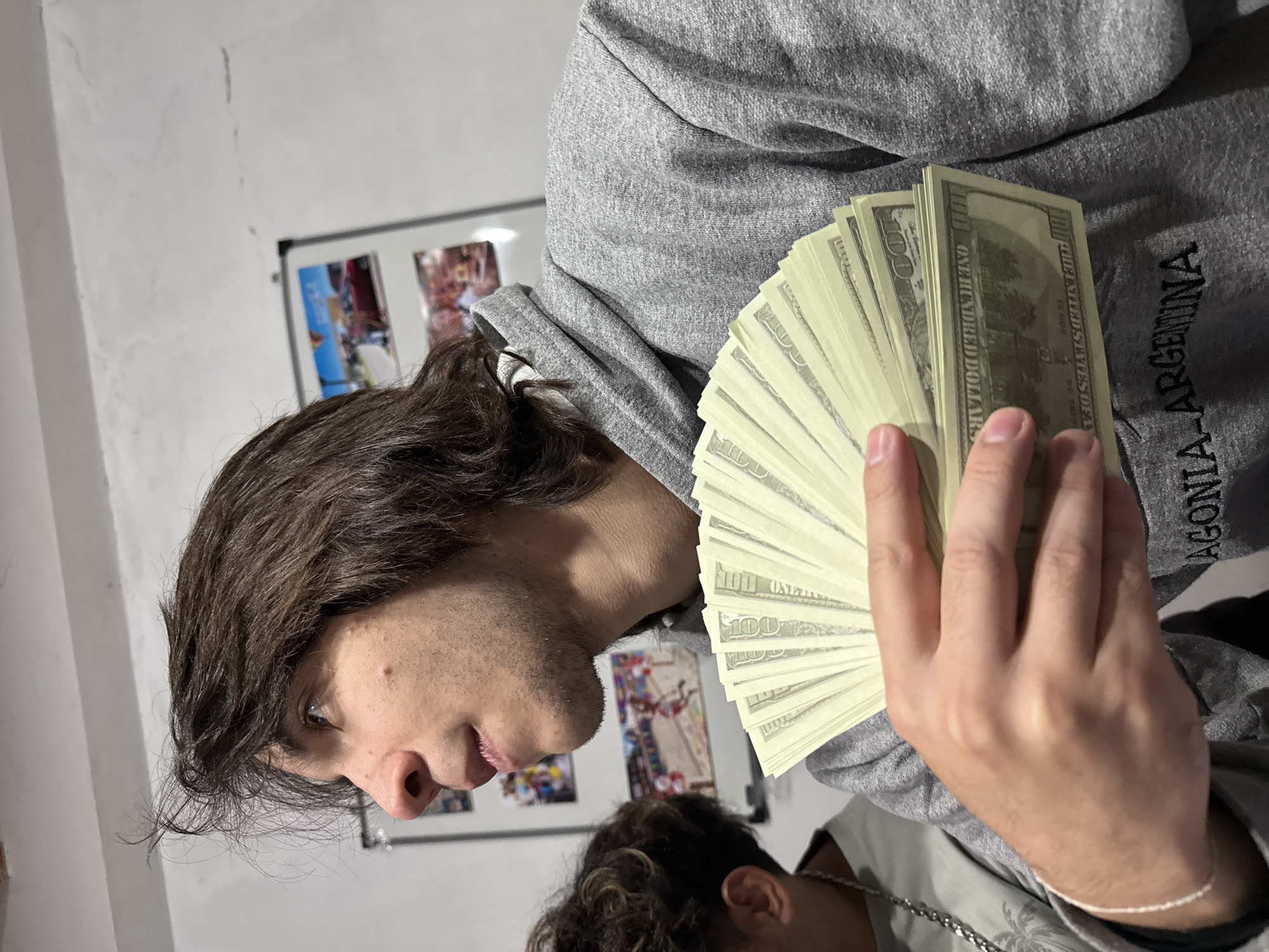 Man displays cash fan in Catamarca, Argentina