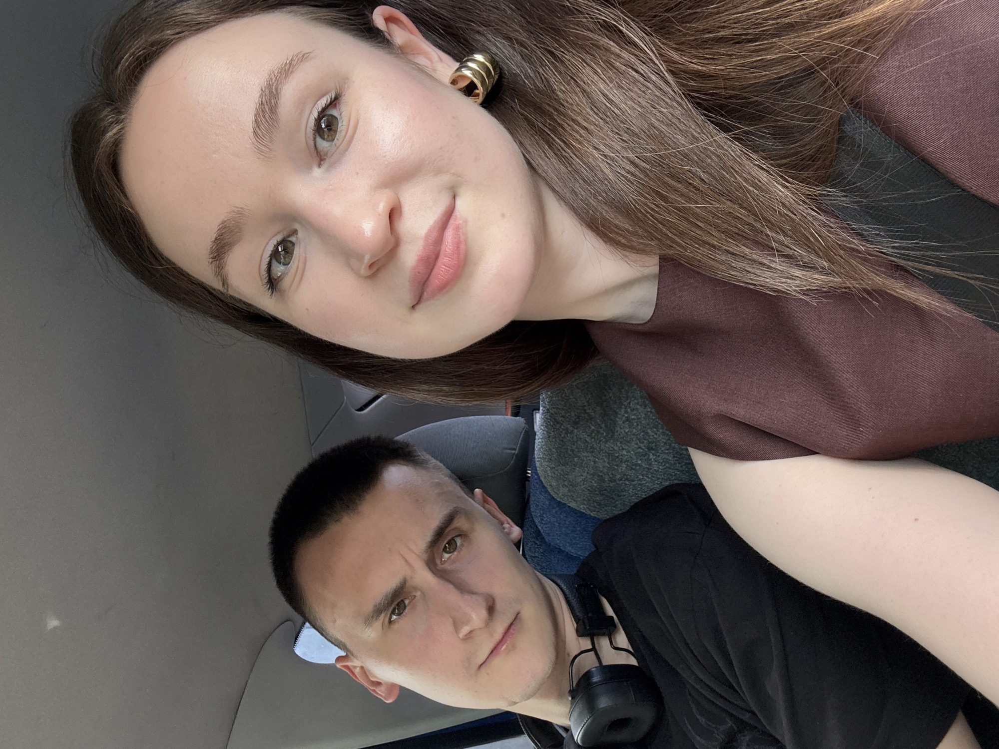 Inside a car and holding a quirky dog statue, Perm