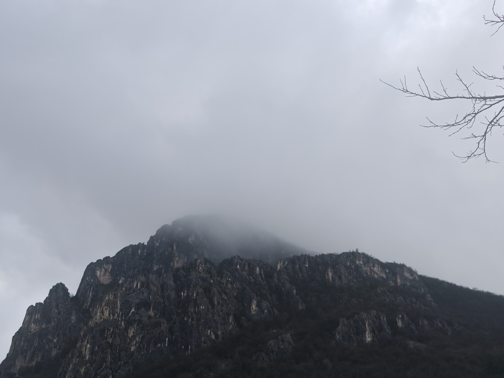 Clouds shroud mountain peak in Vratsa, Bulgaria