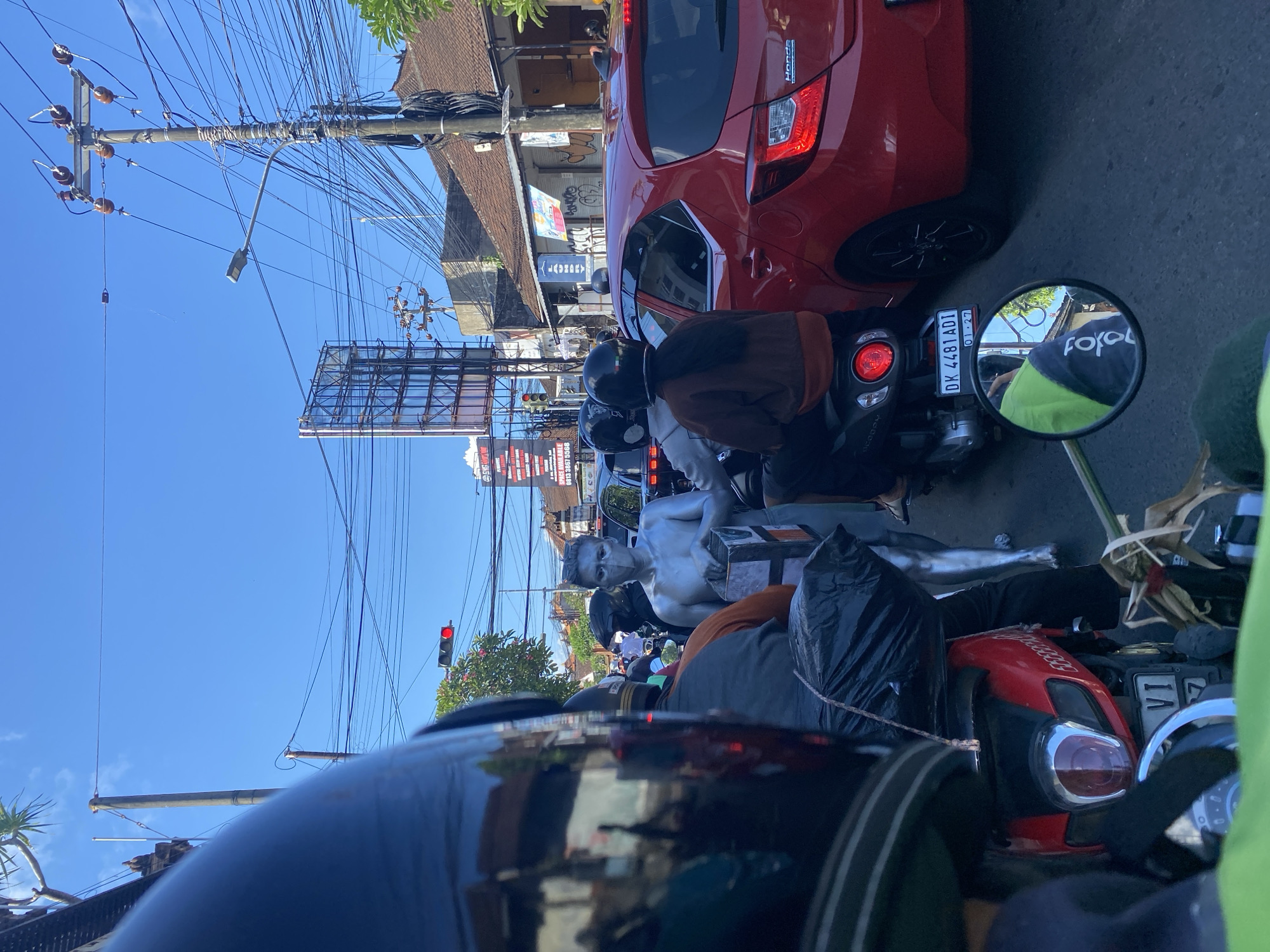 Morning traffic and temple sighting documented in North Kuta