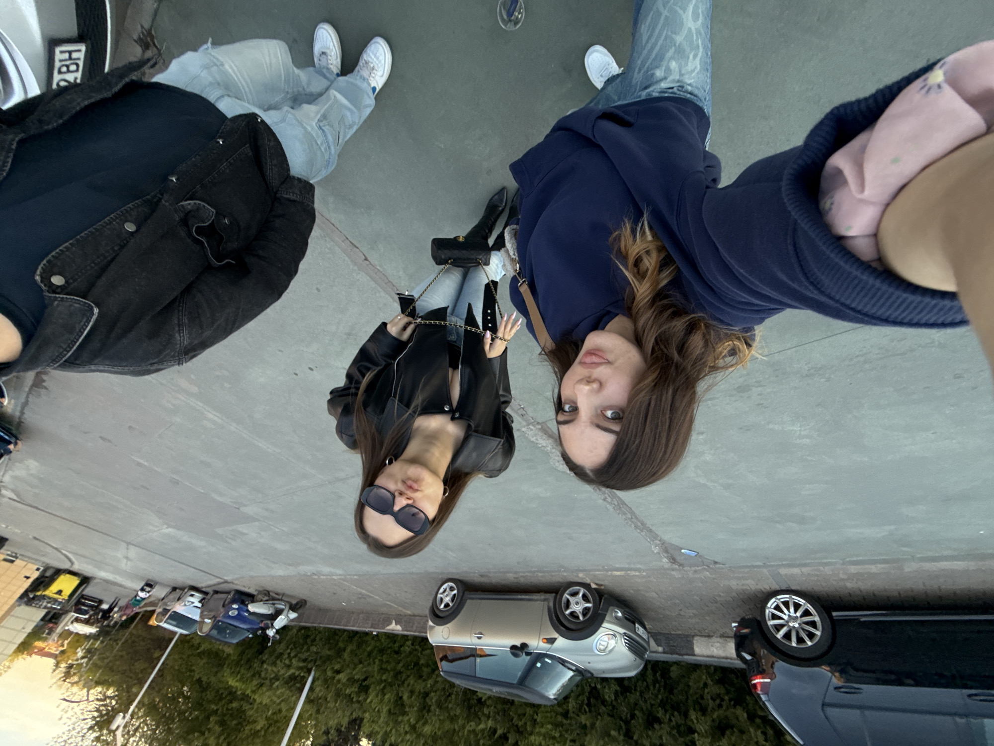 Three people meet outdoors in Sofia, Bulgaria