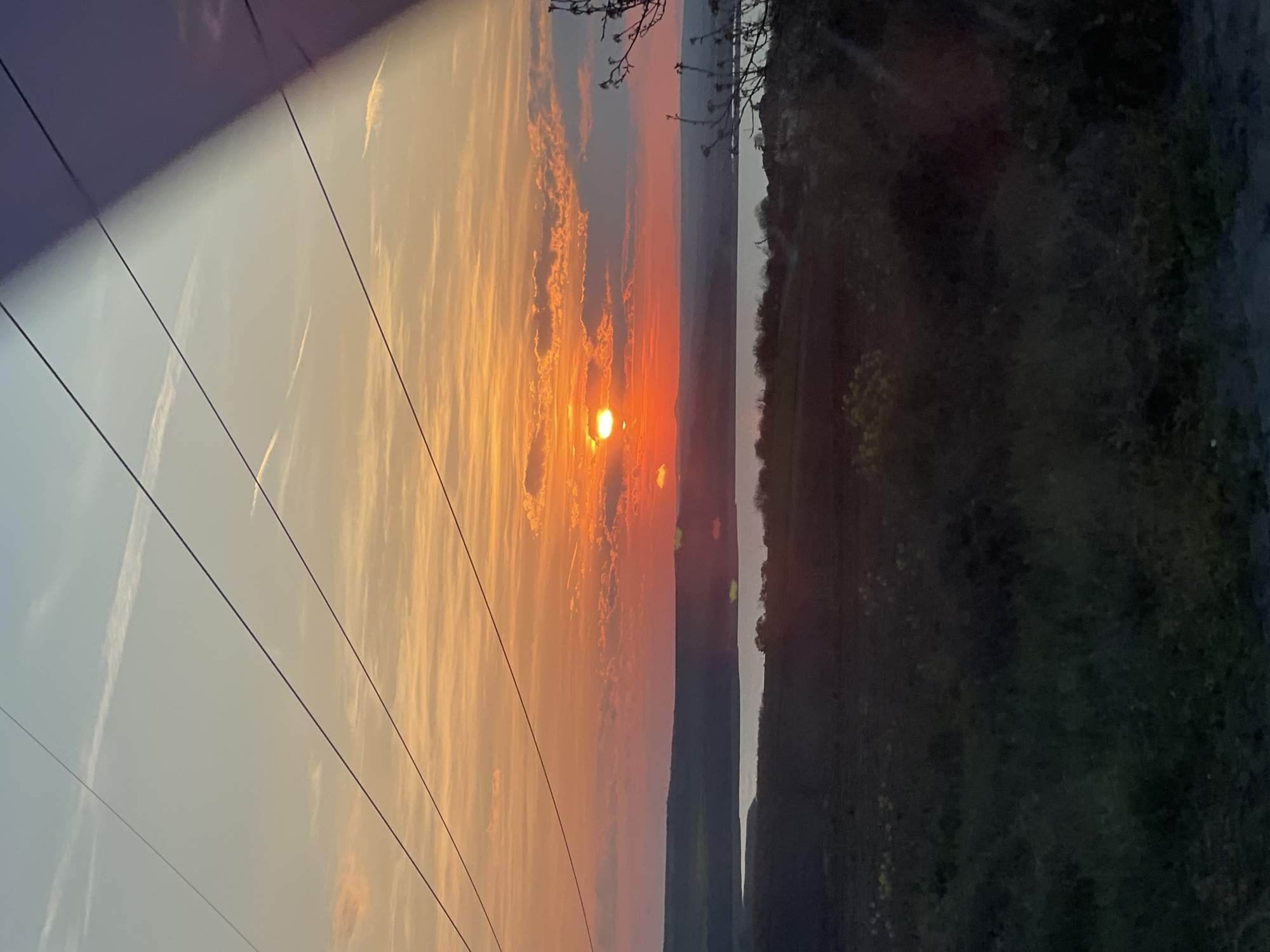 Sunset observed over Burgas landscape with power lines, roads