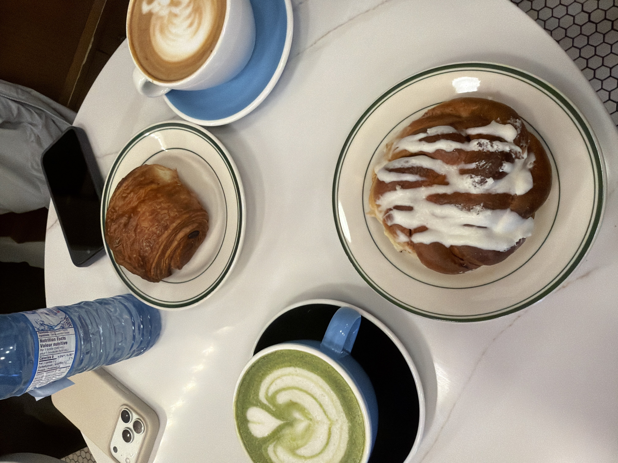 Pastries and coffee at Montreal cafe table
