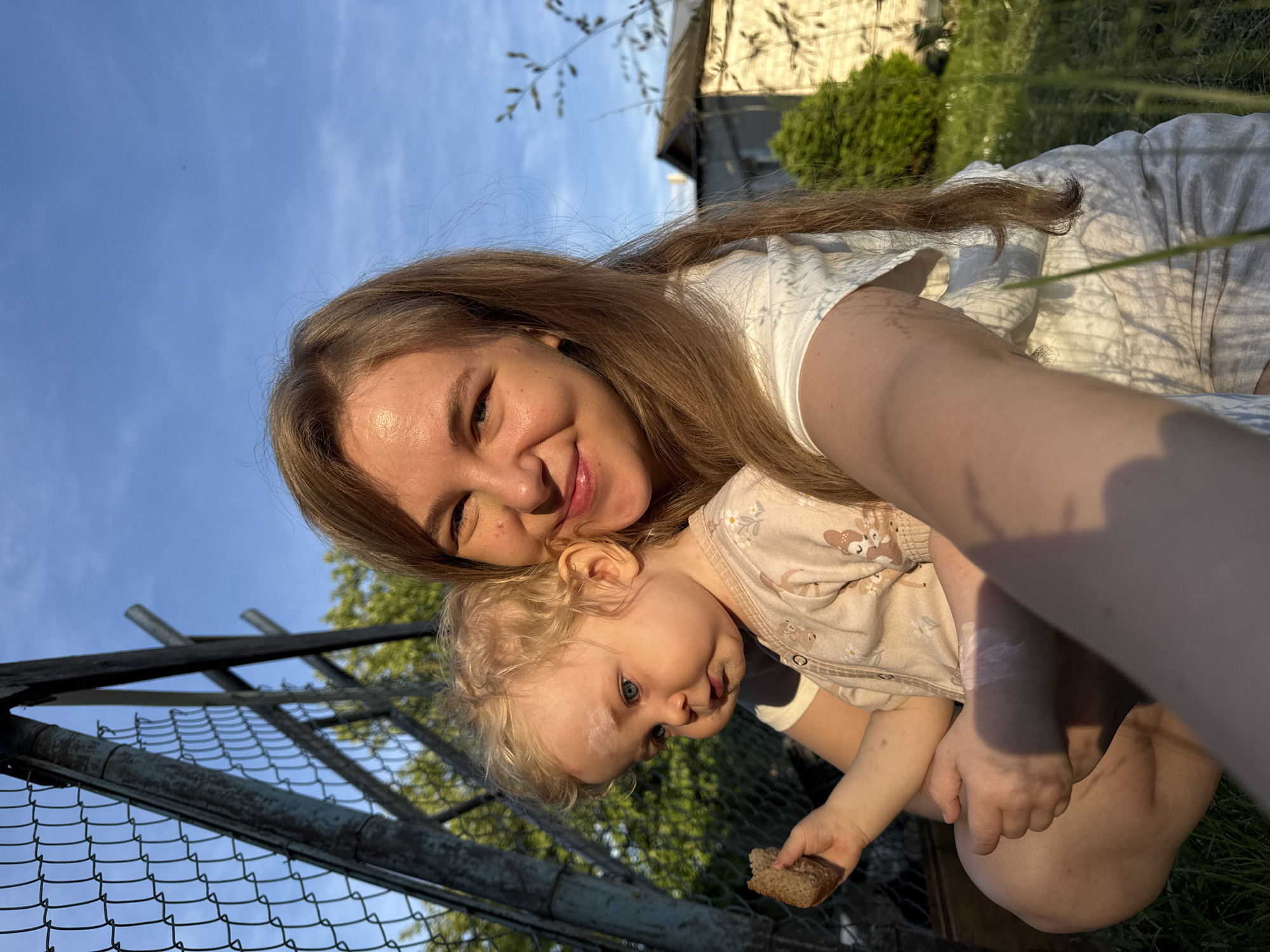 Family visits chicken coop in Russian village afternoon