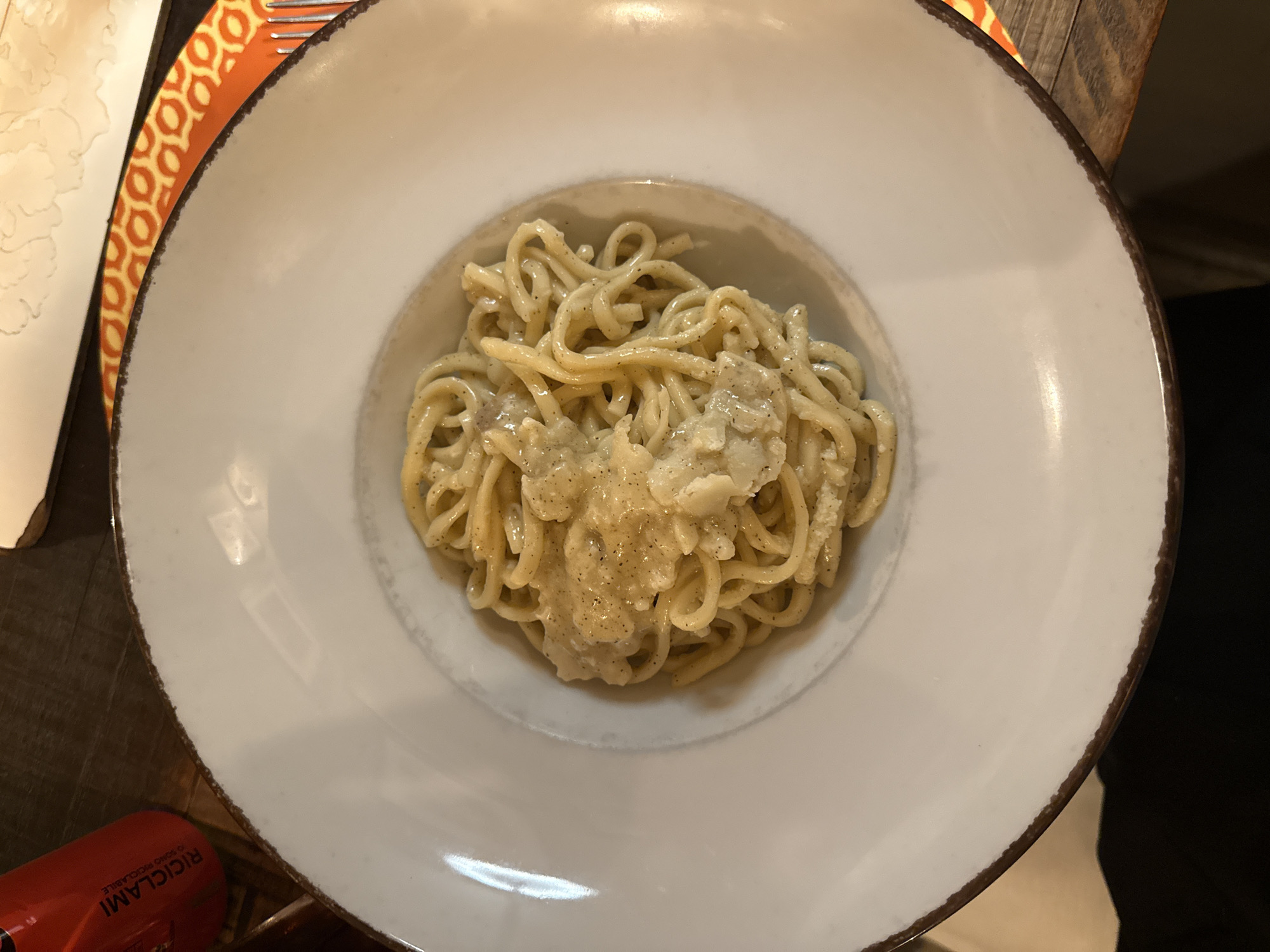 Rome diner documents pasta and dessert service from cheese wheel