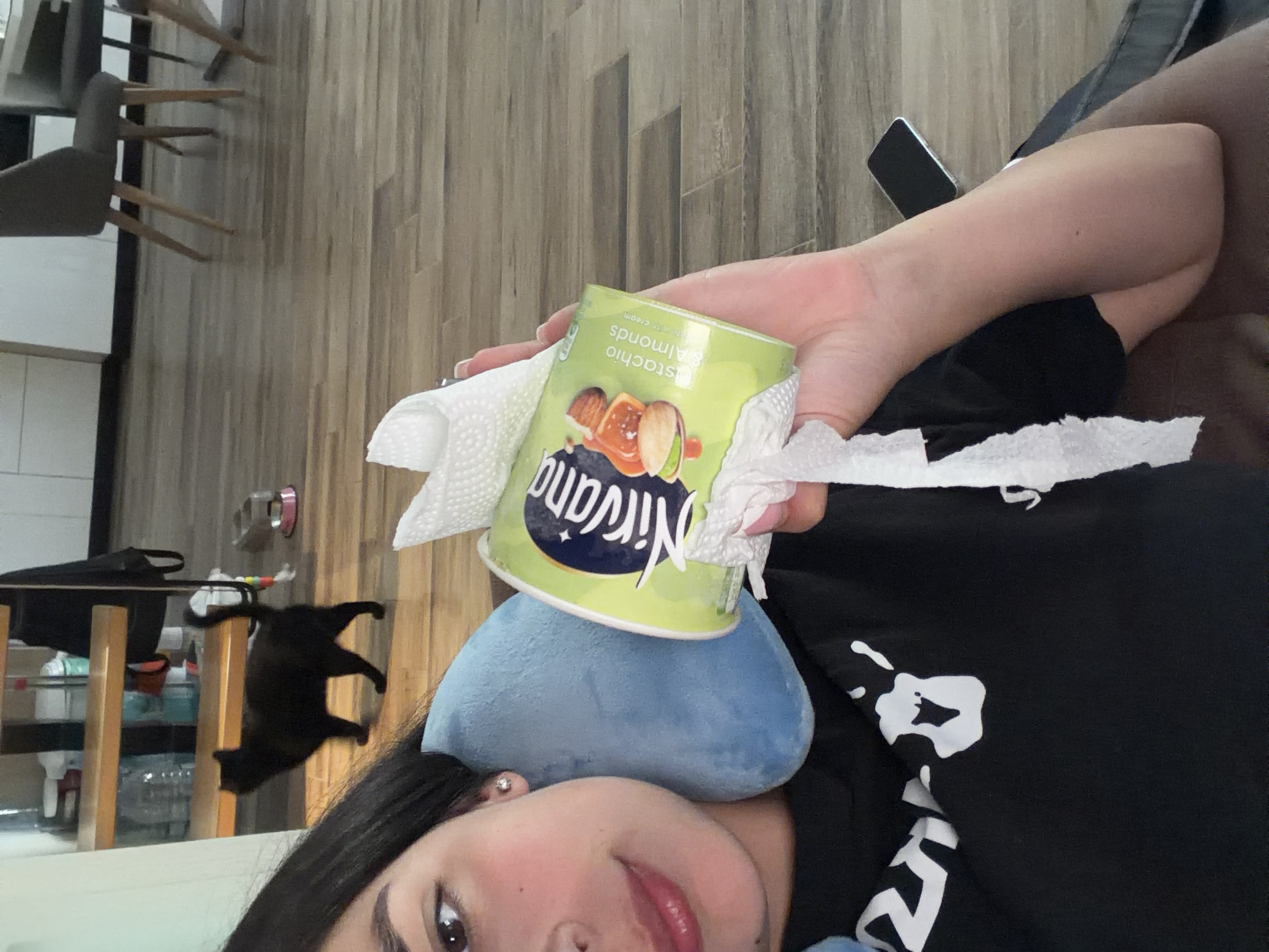 Woman enjoys ice cream on couch in Gabrovo