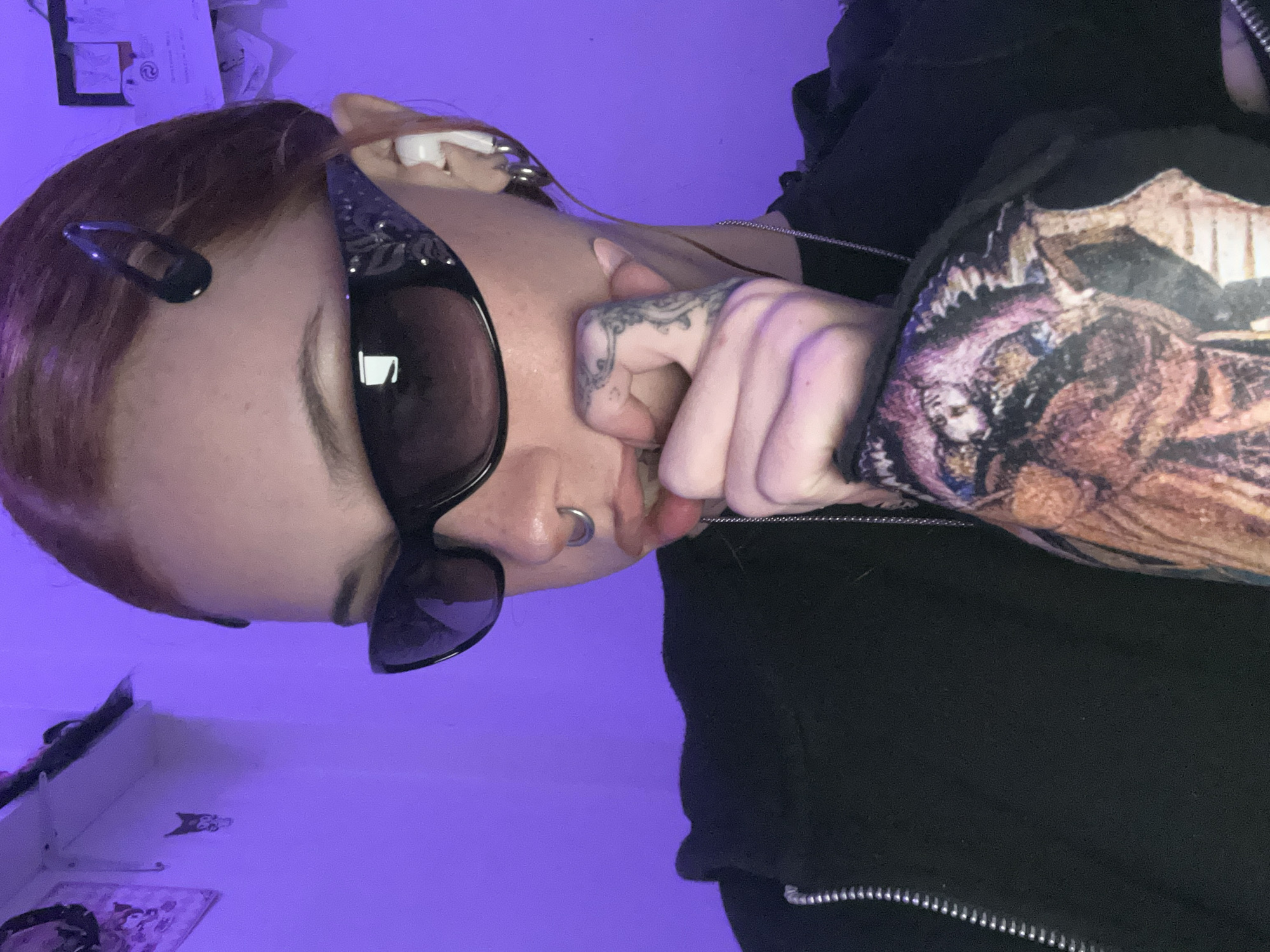 Young woman with piercings, tattoos observed in Buenos Aires