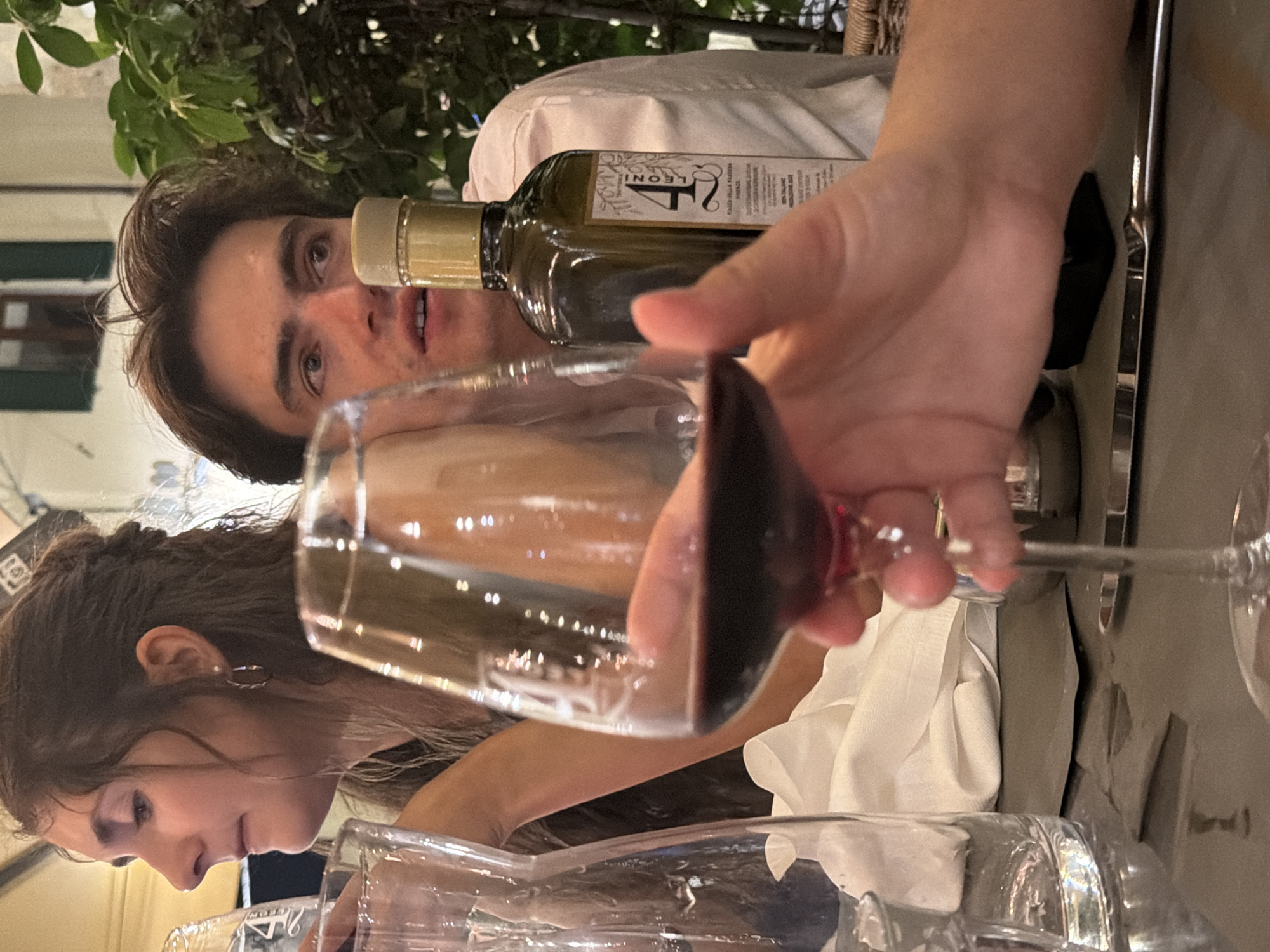 Couple dines outdoors in Florence evening