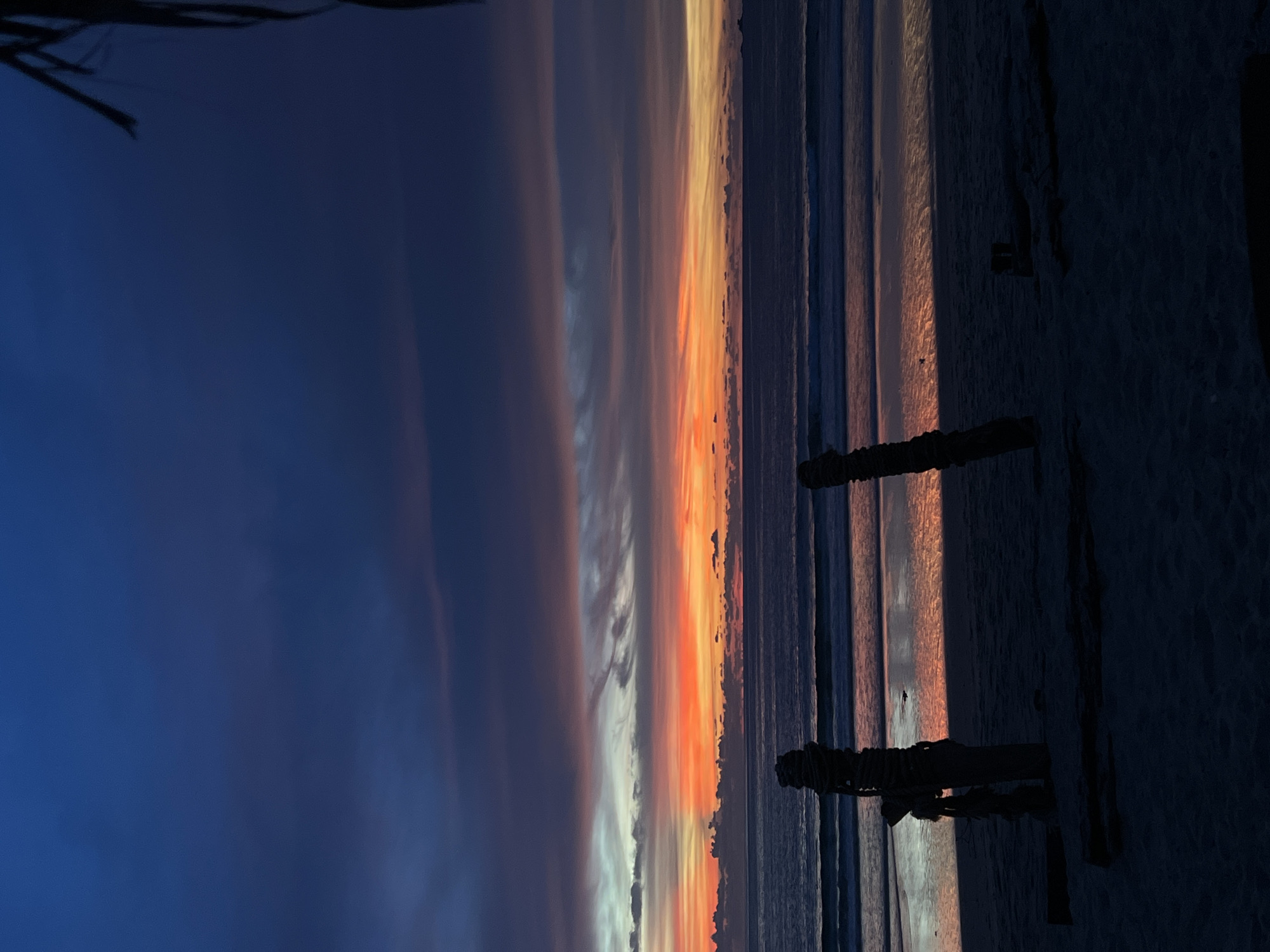 Sunset on the beach, waves, vivid skies, and shoreline movement