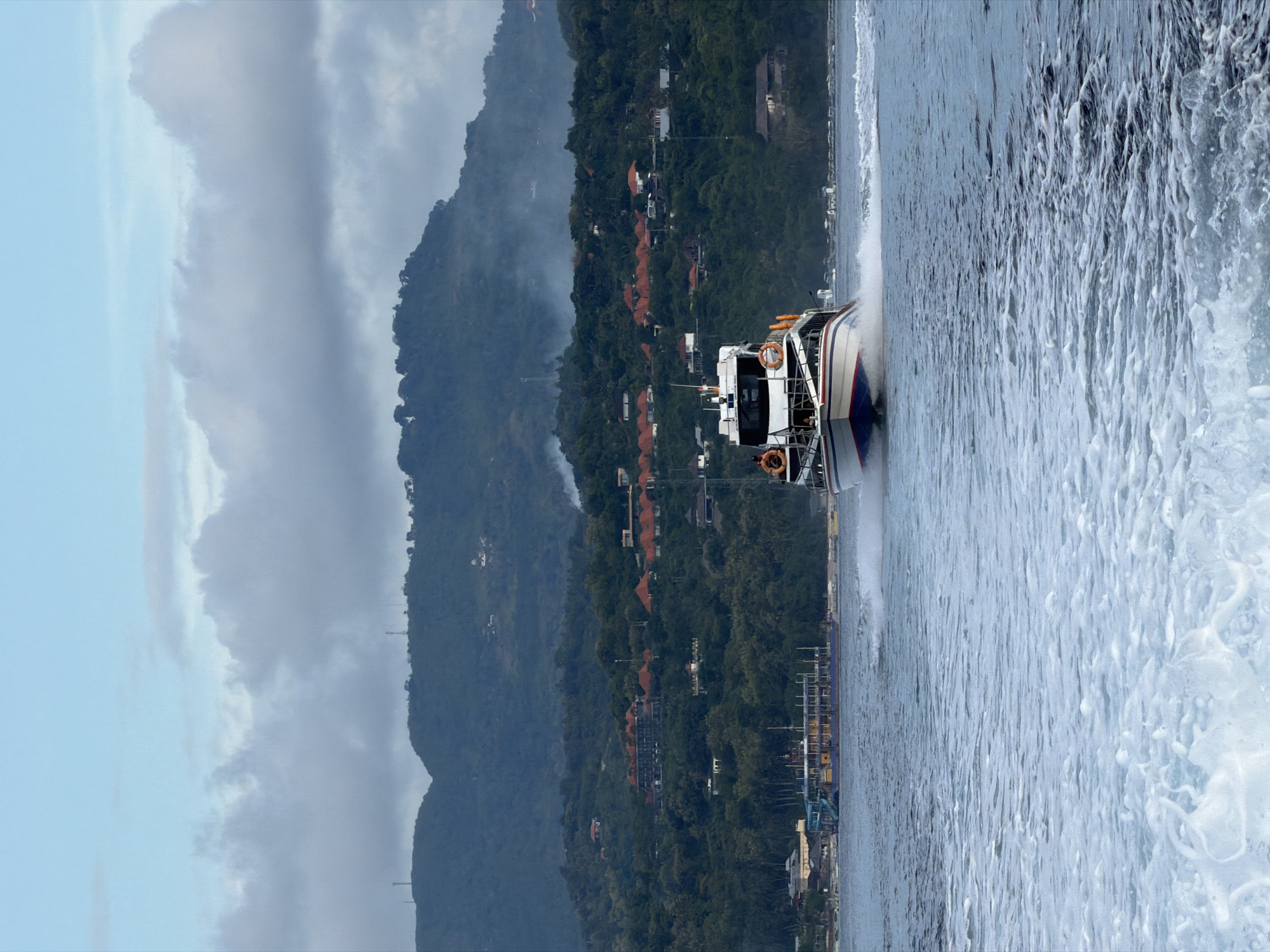 Speedboat creates large wake near Nusa Penida Indonesia