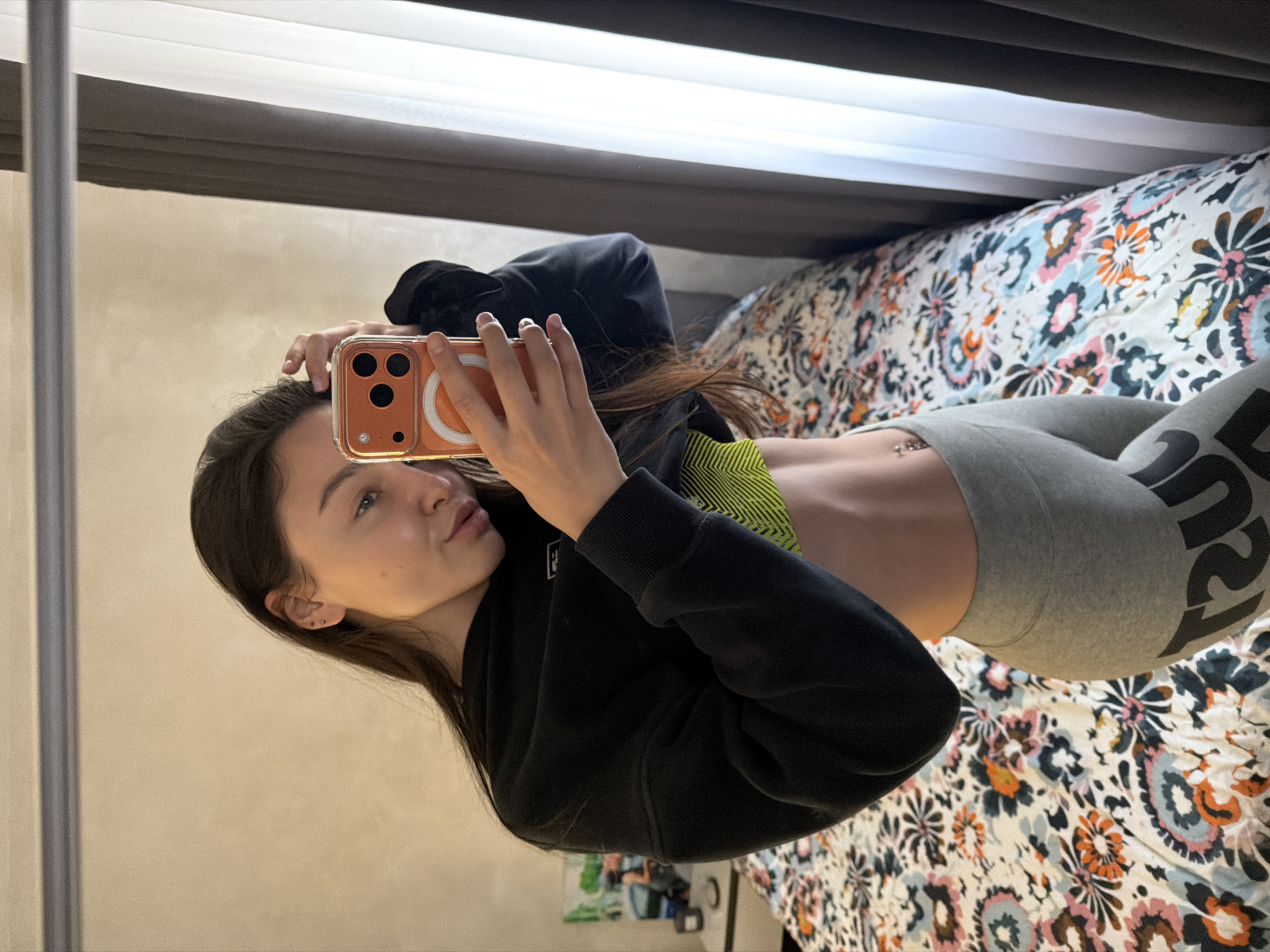 Woman takes mirror selfies in athletic wear in Pernik