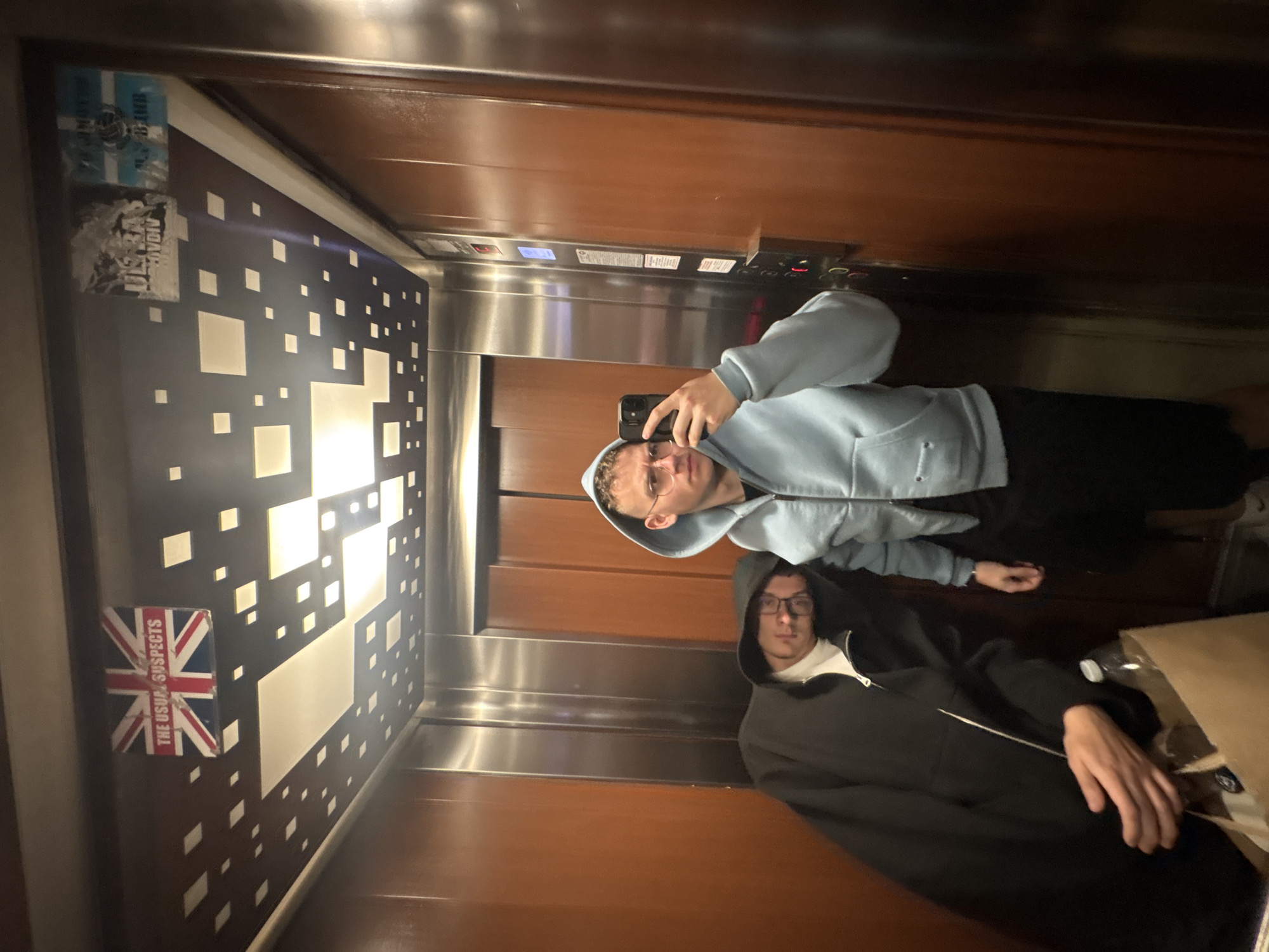 Two men take elevator mirror selfie in Plovdiv