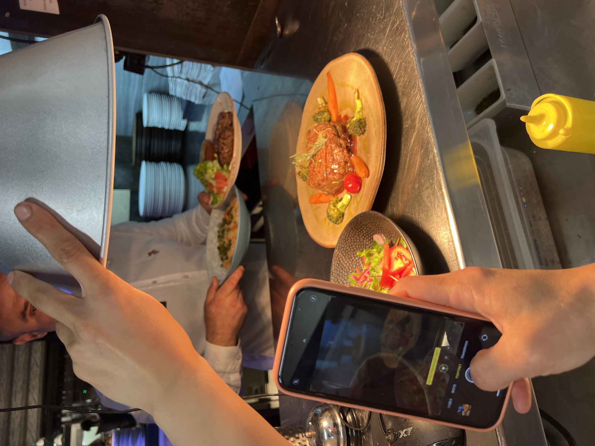 Diner photographs restaurant meals in Budva, Montenegro