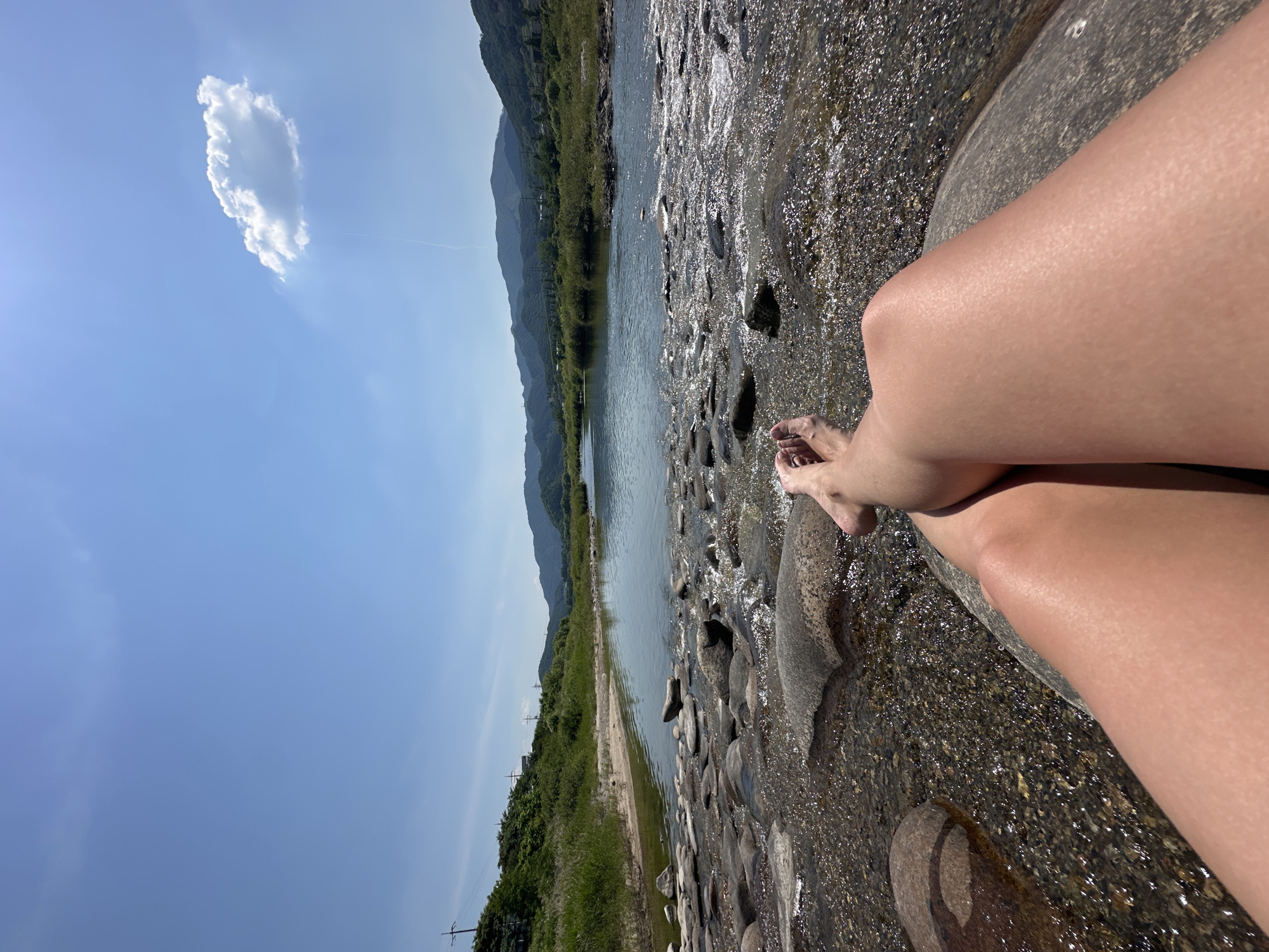 Person rests by clear river in South Korea