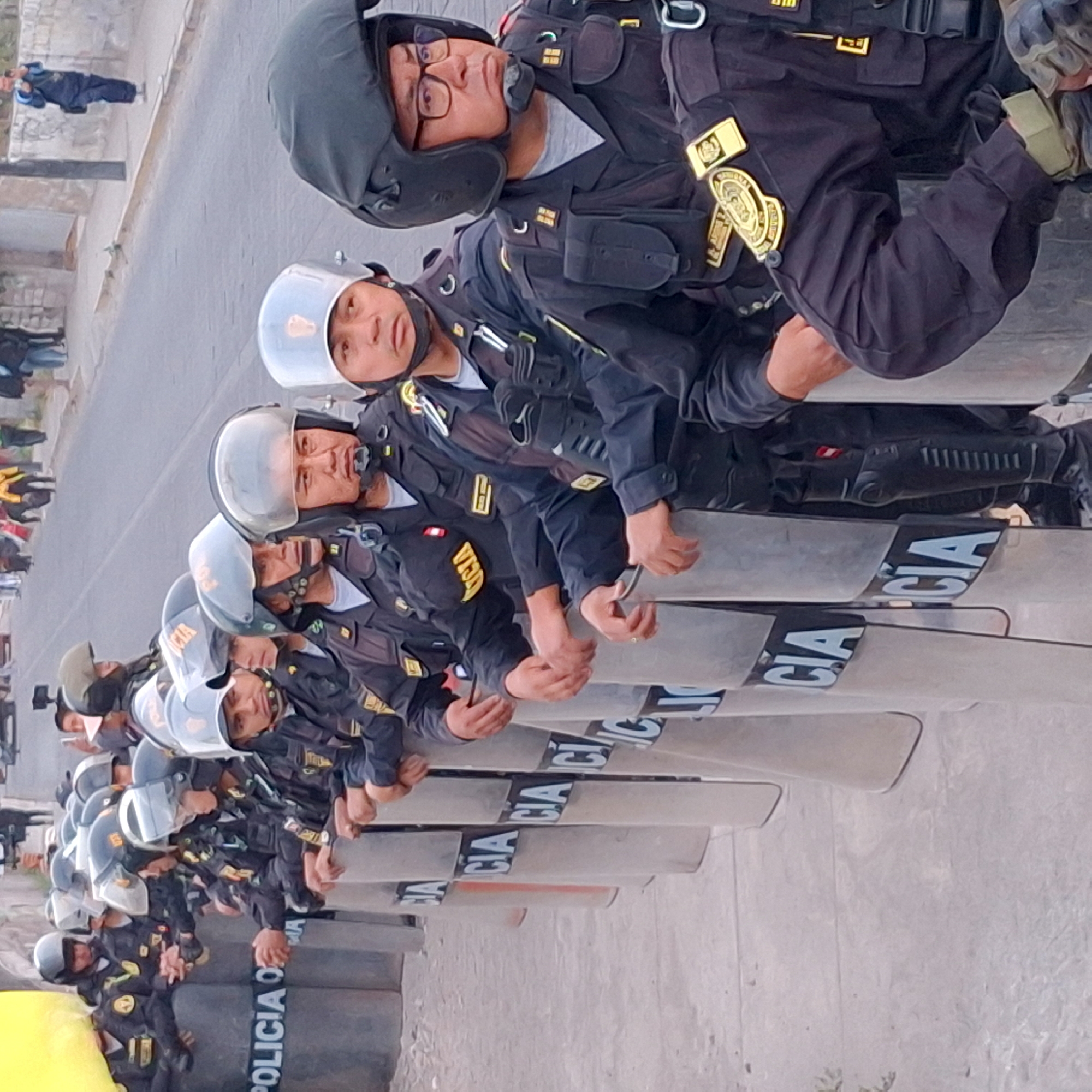 Anti-Fujimori protesters confront riot police outside Arequipa rally venue