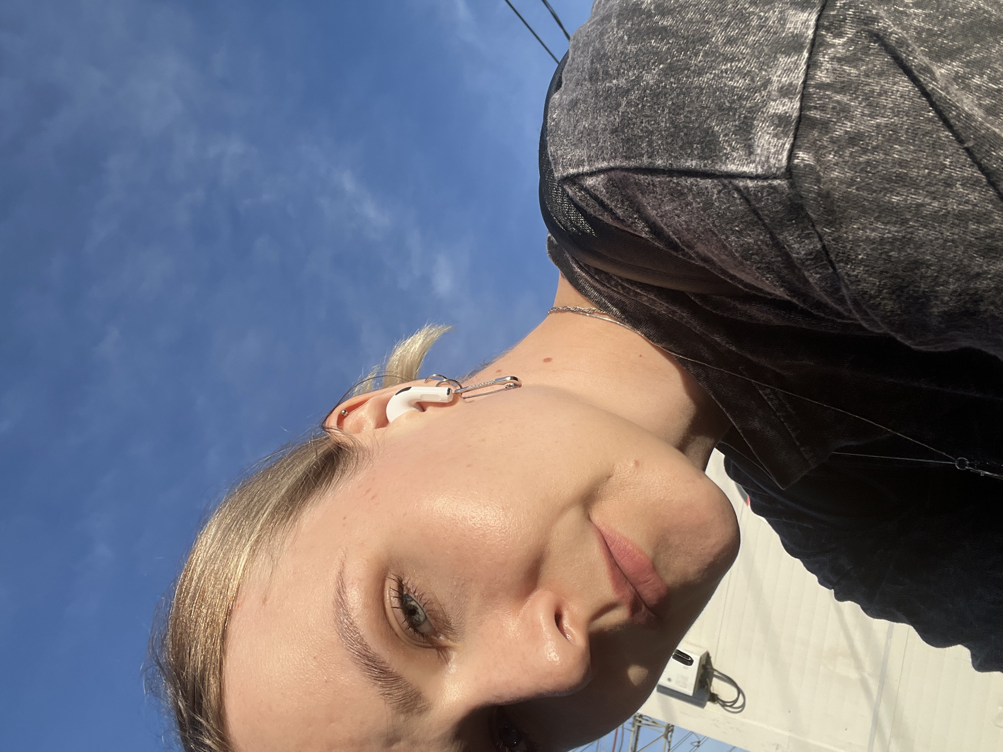 Quick selfie series near Khimki with earbuds and outdoor backdrop