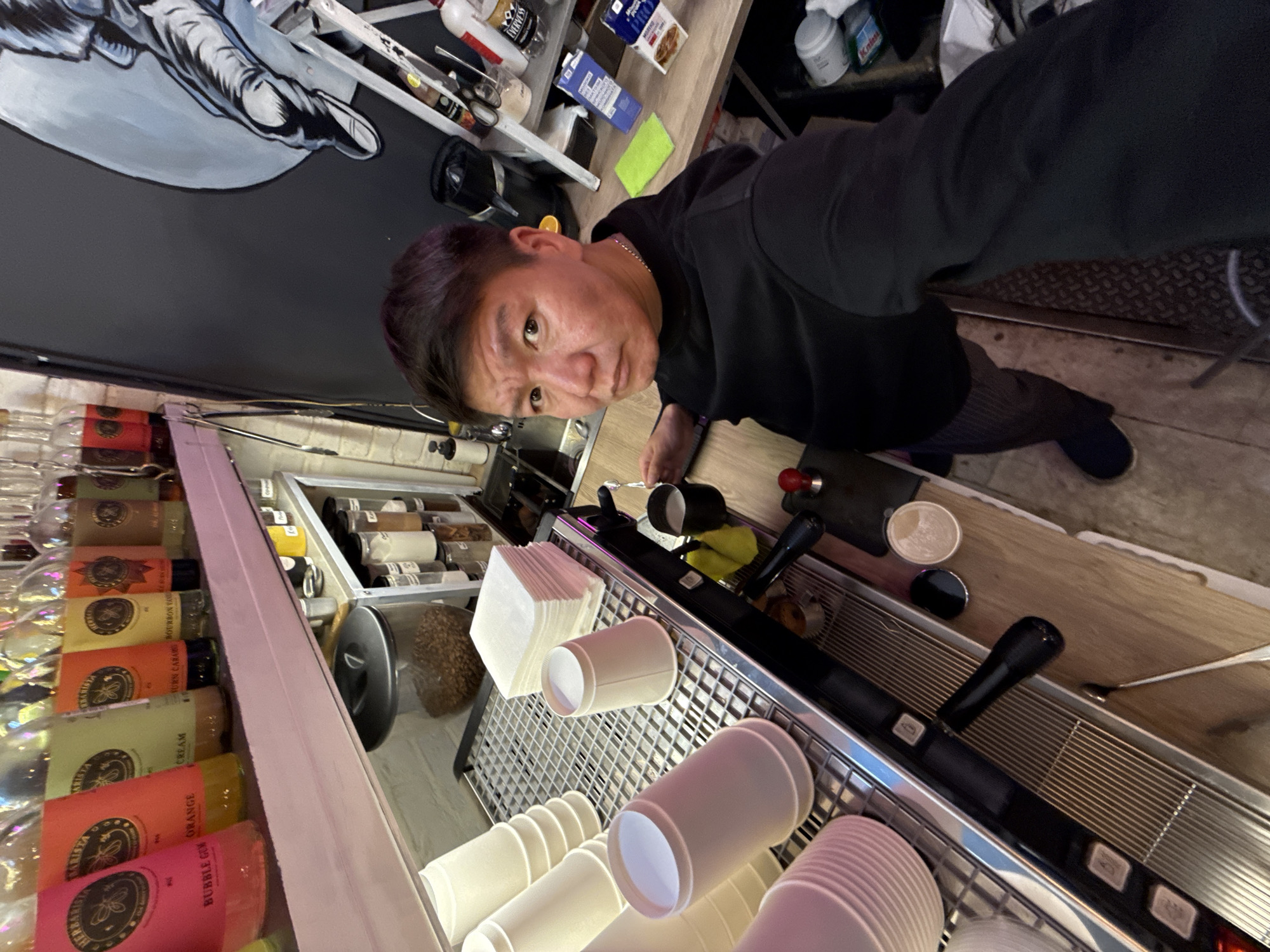 Selfie moment in front of a Moscow café espresso machine