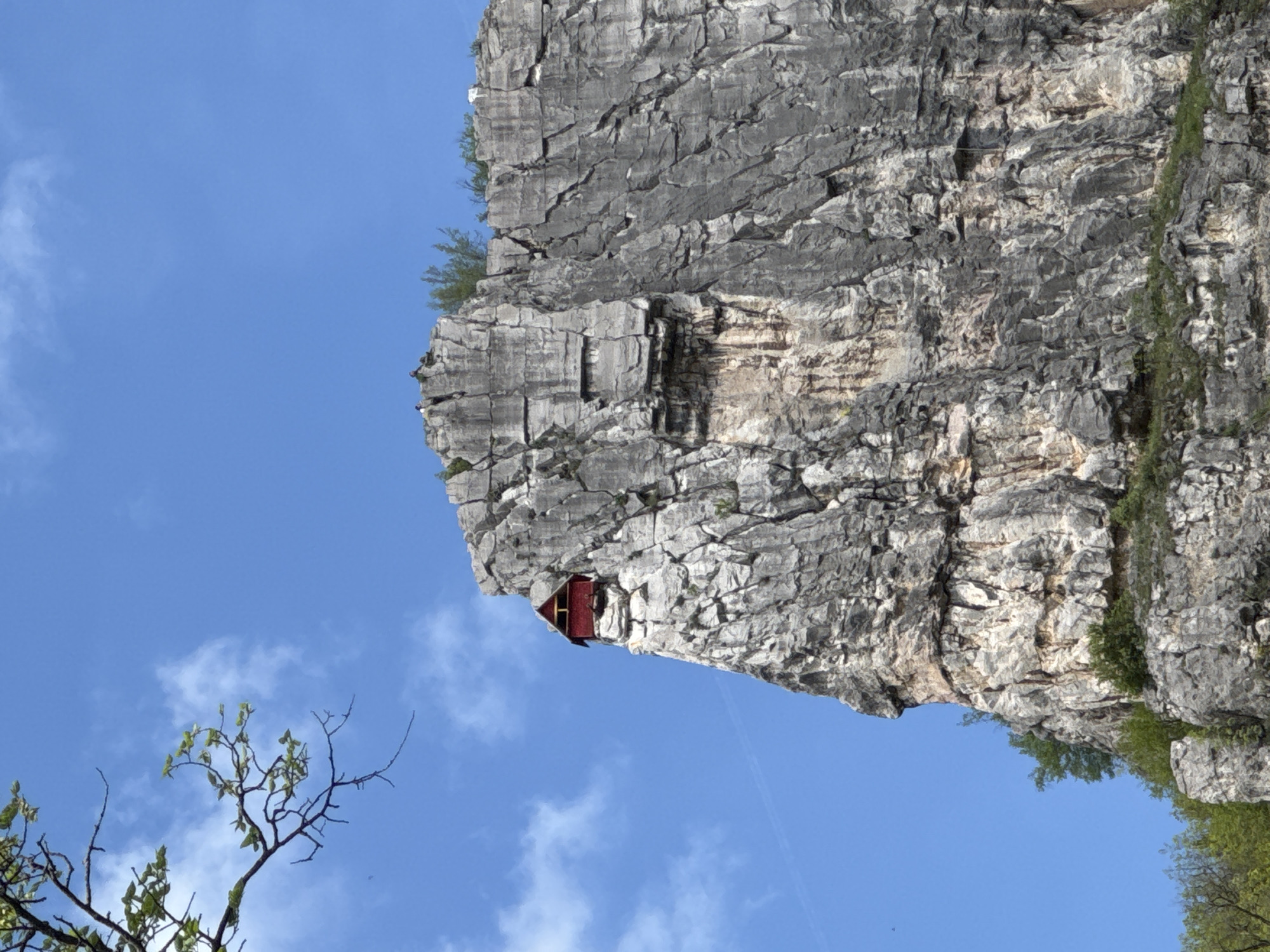Spring morning captures Bulgaria's rocky cliffs and cascading waterfall