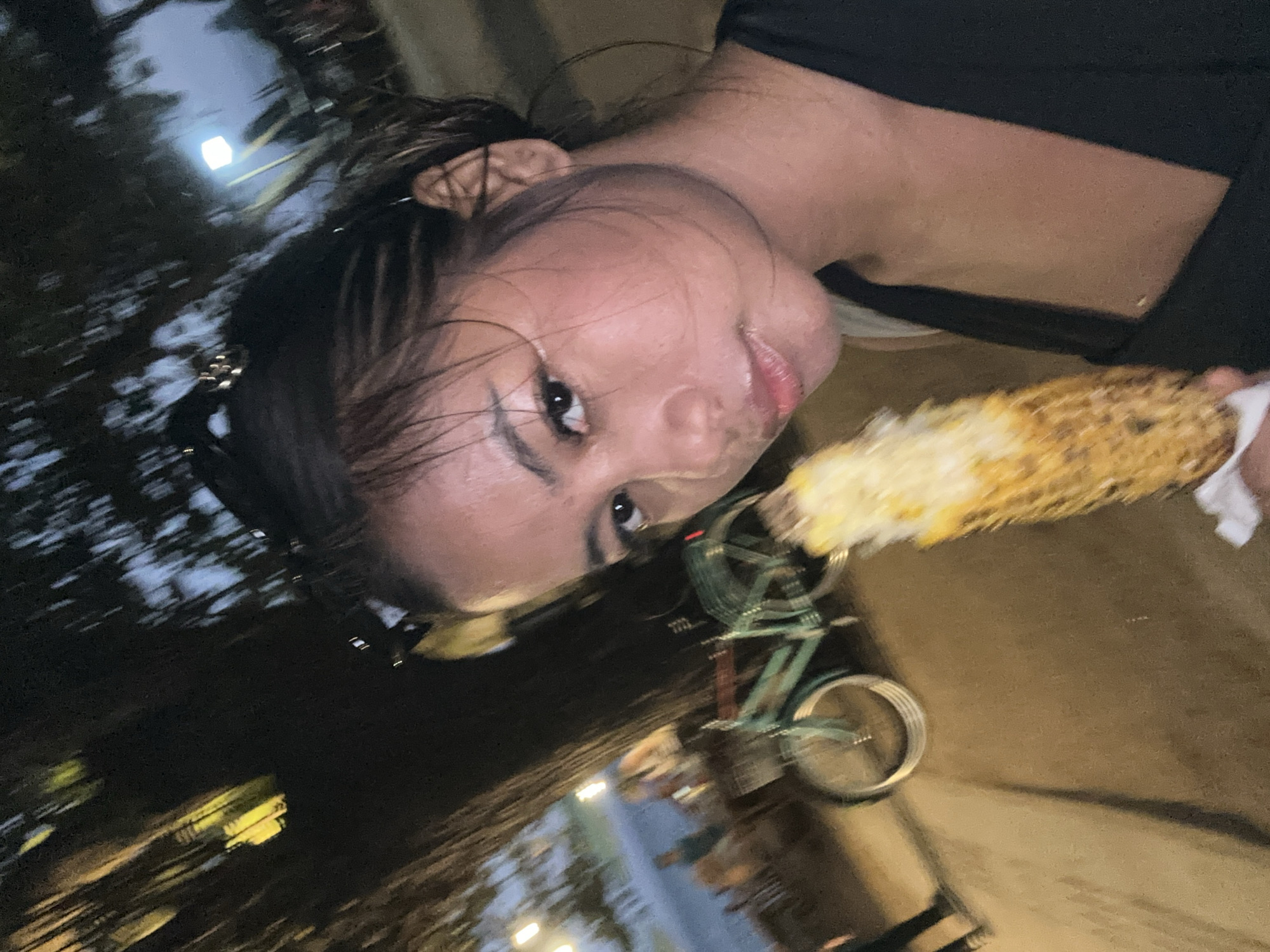 Casual beach day documented in Denpasar with corn vendors, tourists