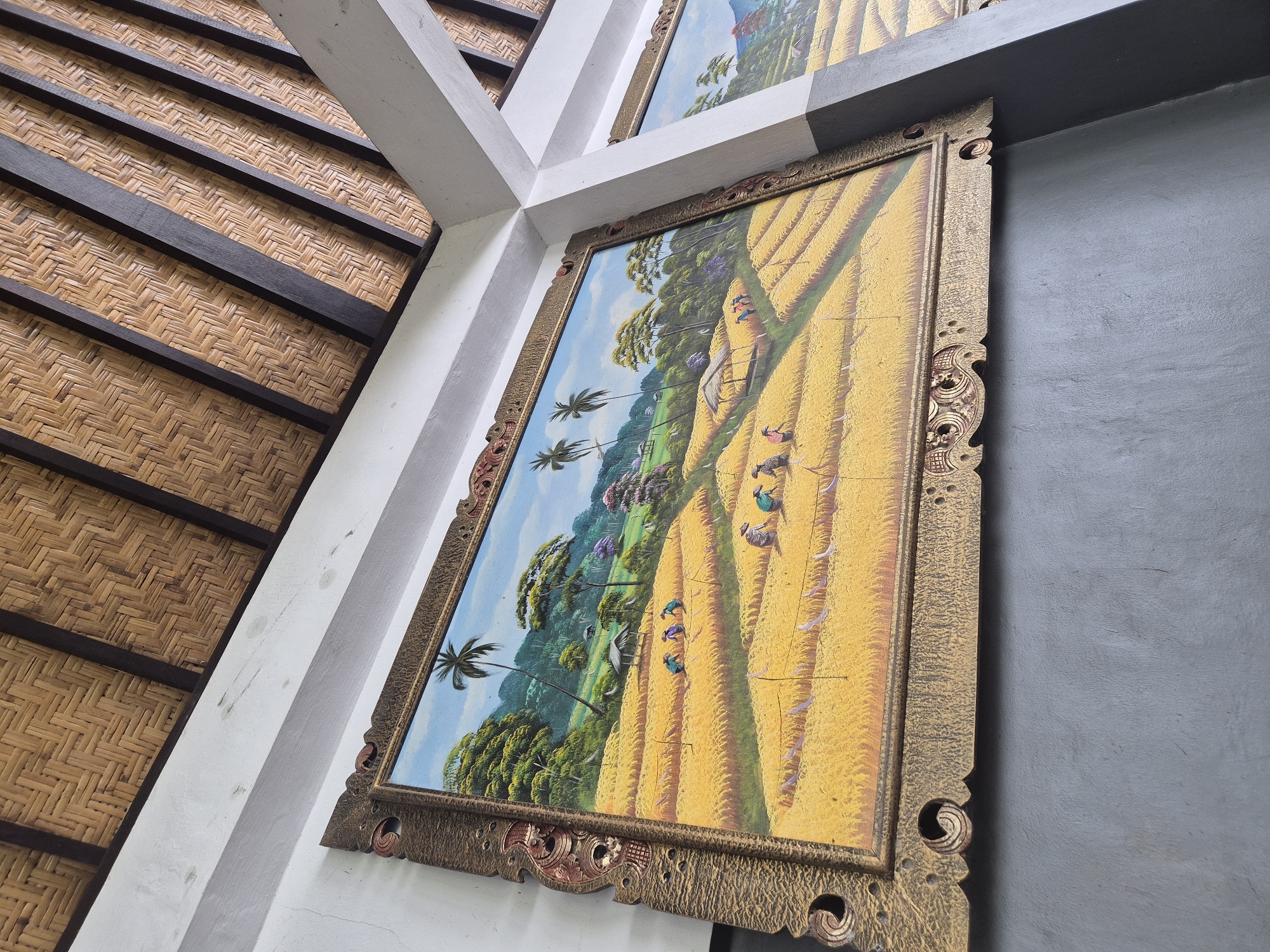 Ornate framed painting observed on interior wall in Canggu