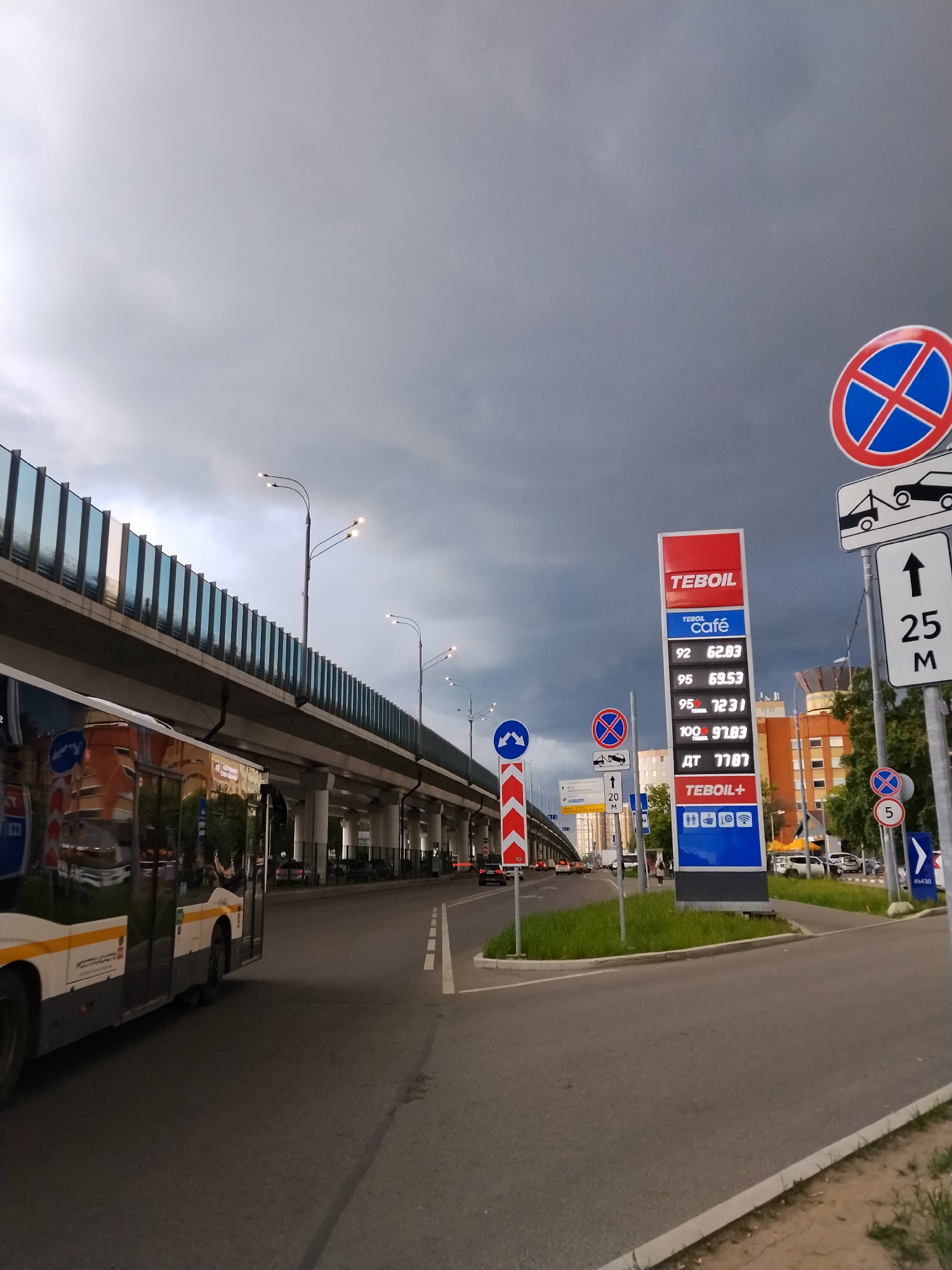 Storm clouds gather over Moscow suburbs, electric scooters await riders