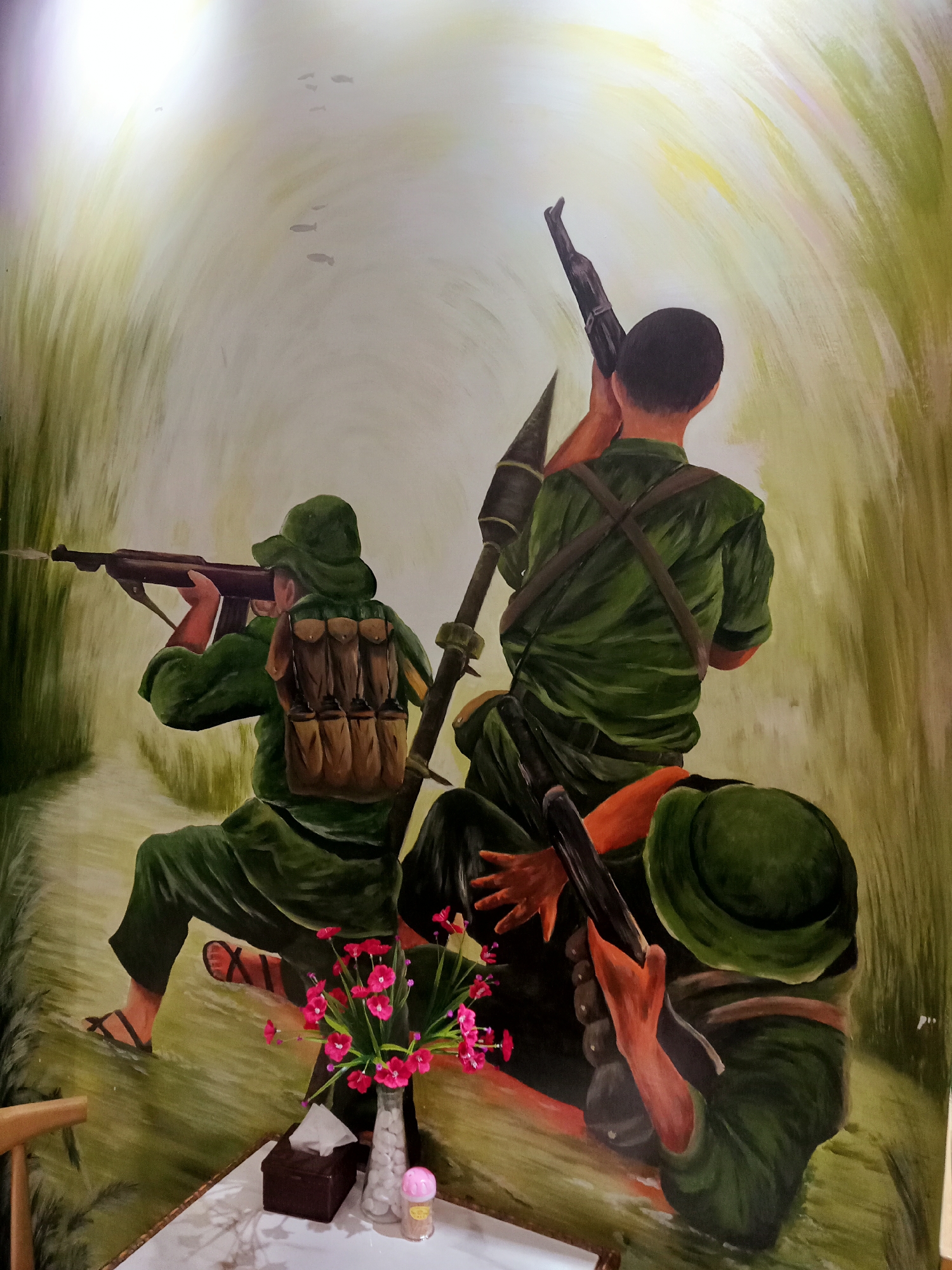 Military-themed cafe with jungle mural documented in Nha Trang