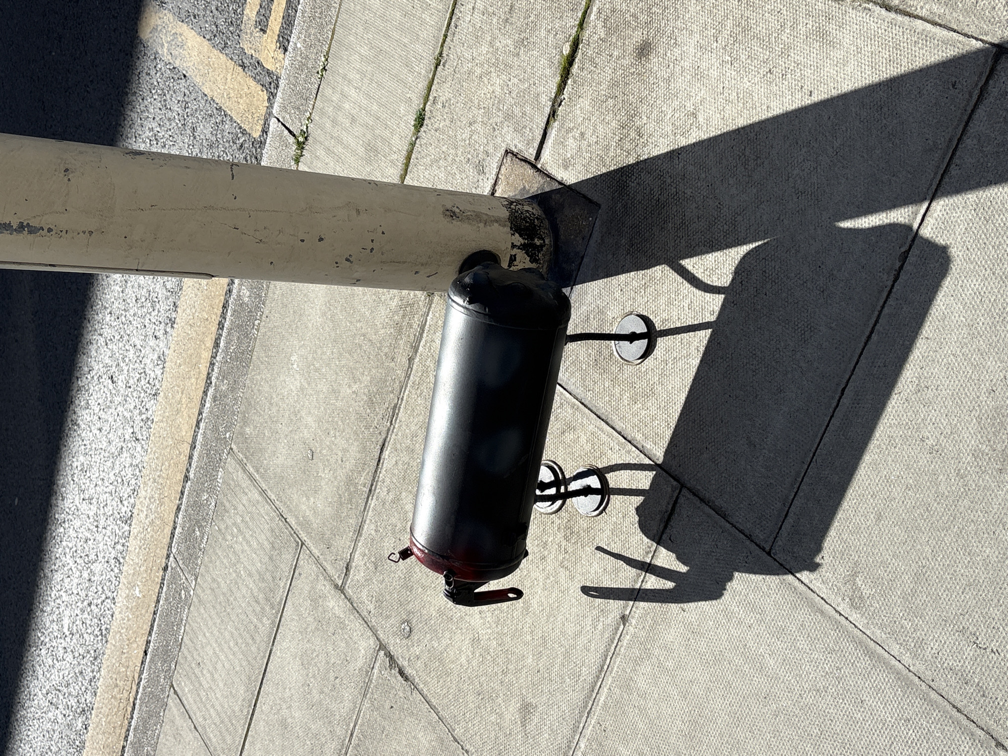 Street-mounted cylindrical object documented in London