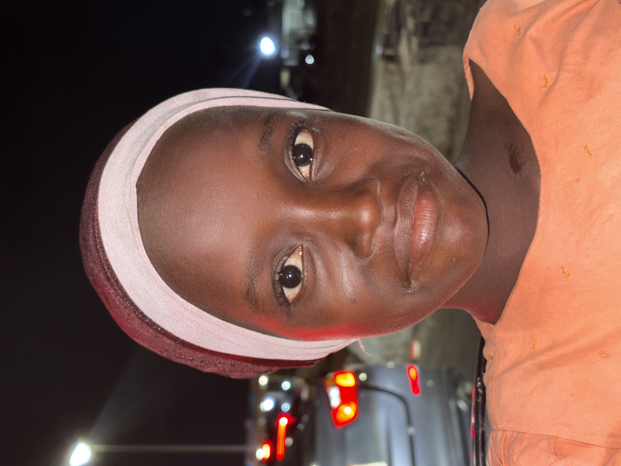 Two women photographed together in Alaguntan, Nigeria evening