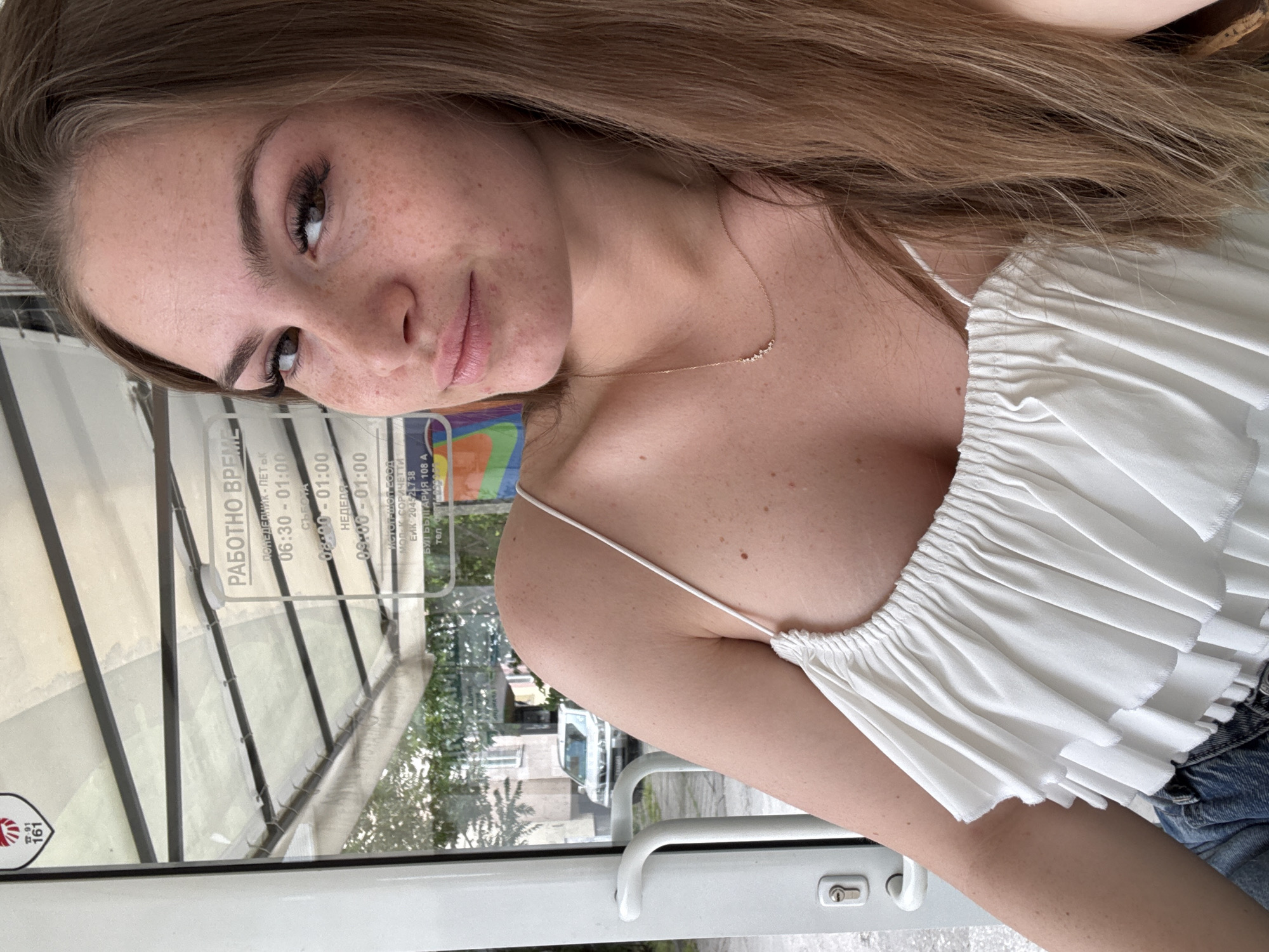 Woman takes selfies near beer crate in Plovdiv