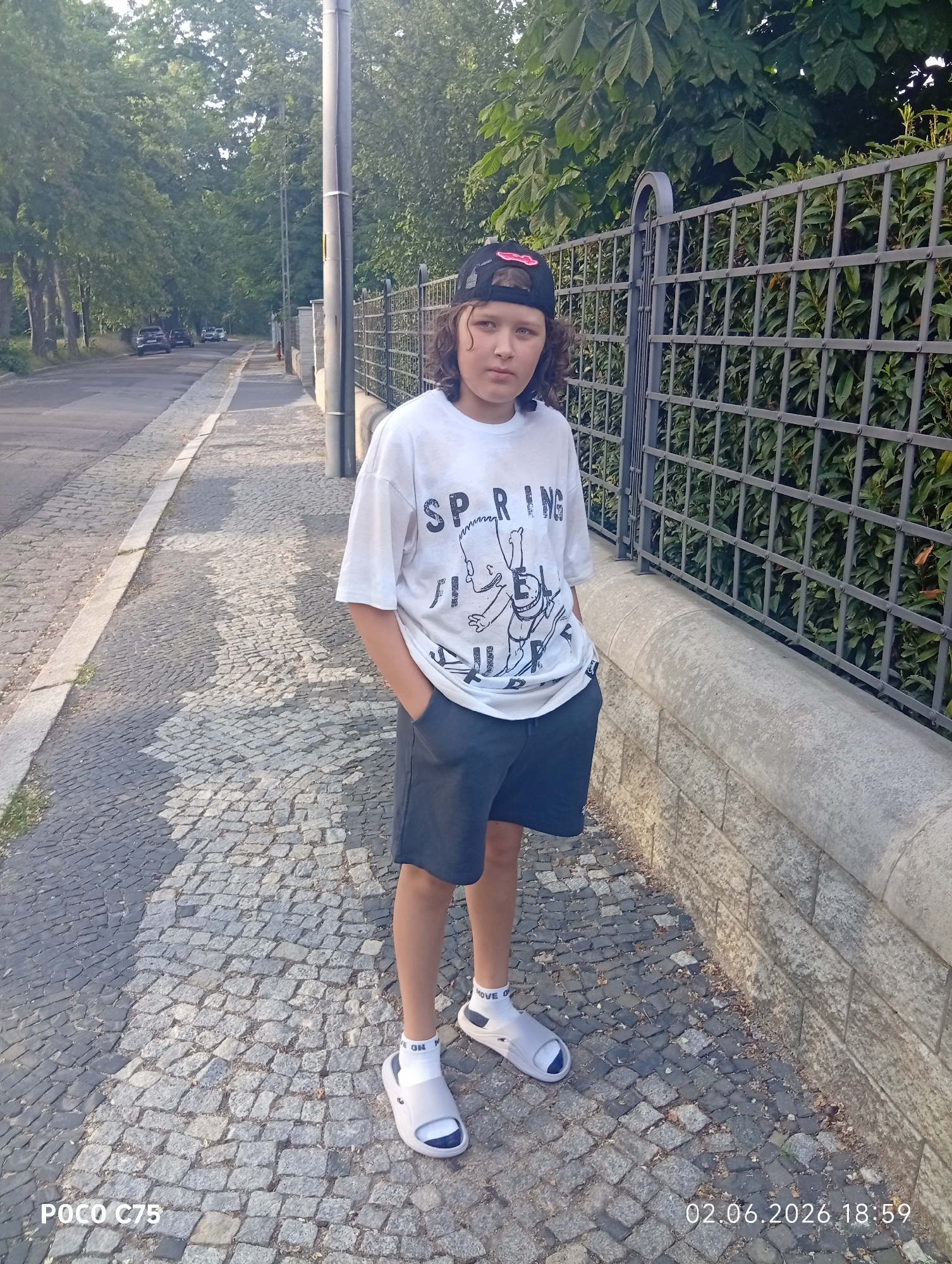 Young person photographed on cobblestone street in Wrocław