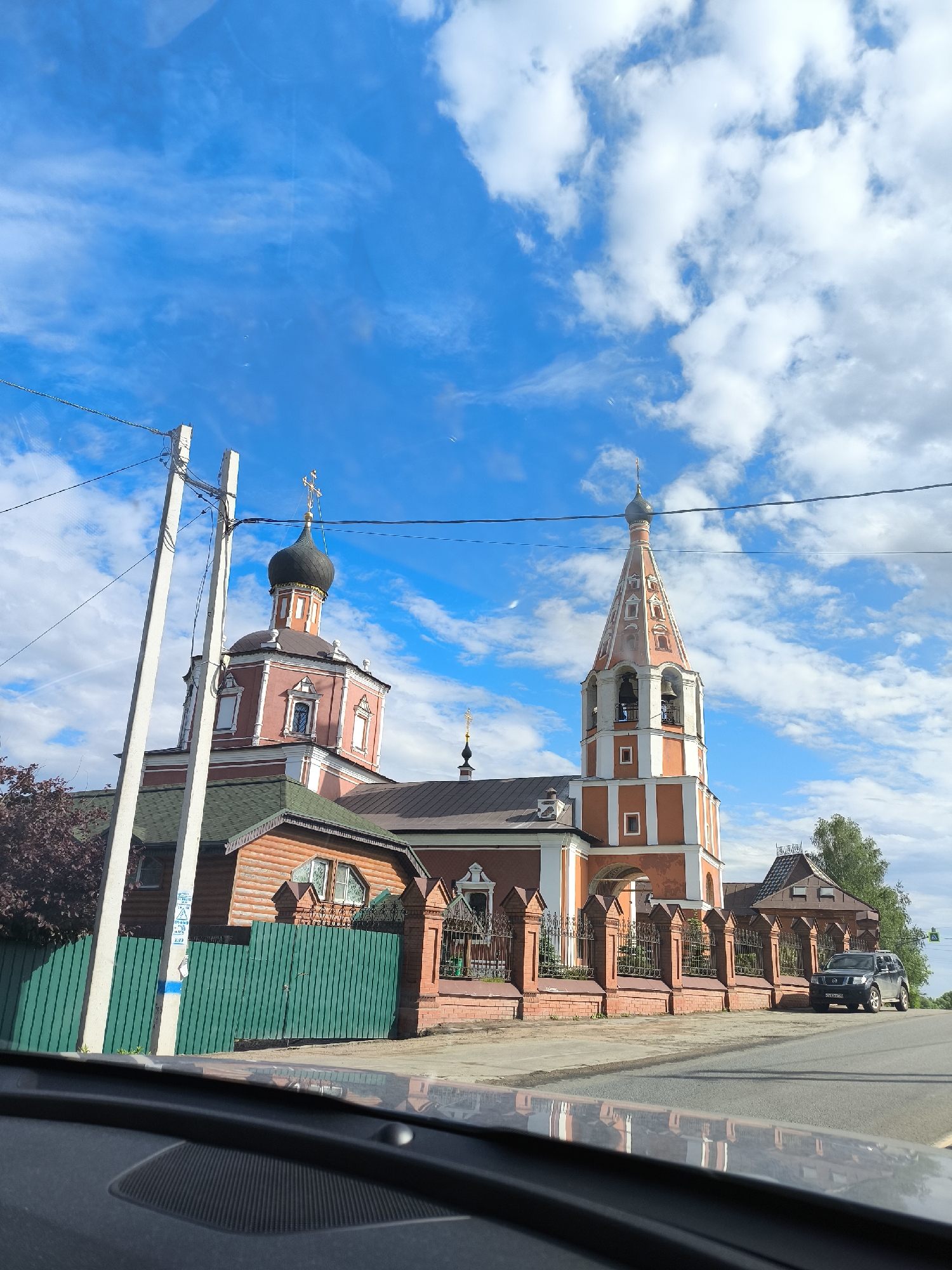 Visitors document Orthodox churches and waterfront scenery during afternoon tour