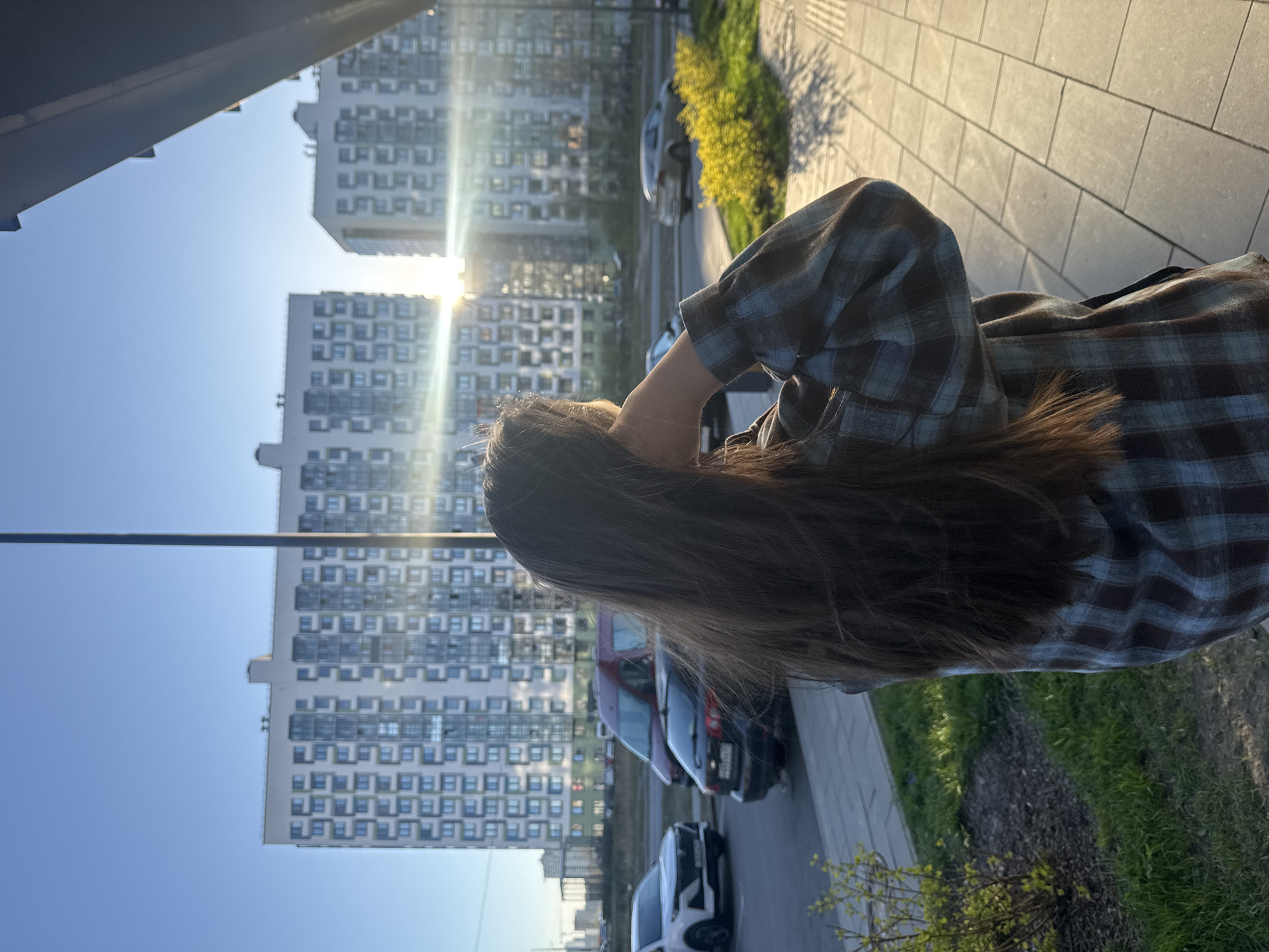 Woman in plaid shirt observed outdoors in Russia