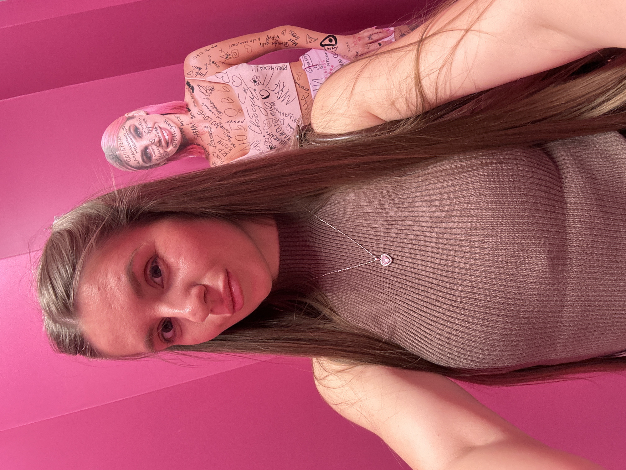 Women take selfies at pink-themed art installation in Moscow