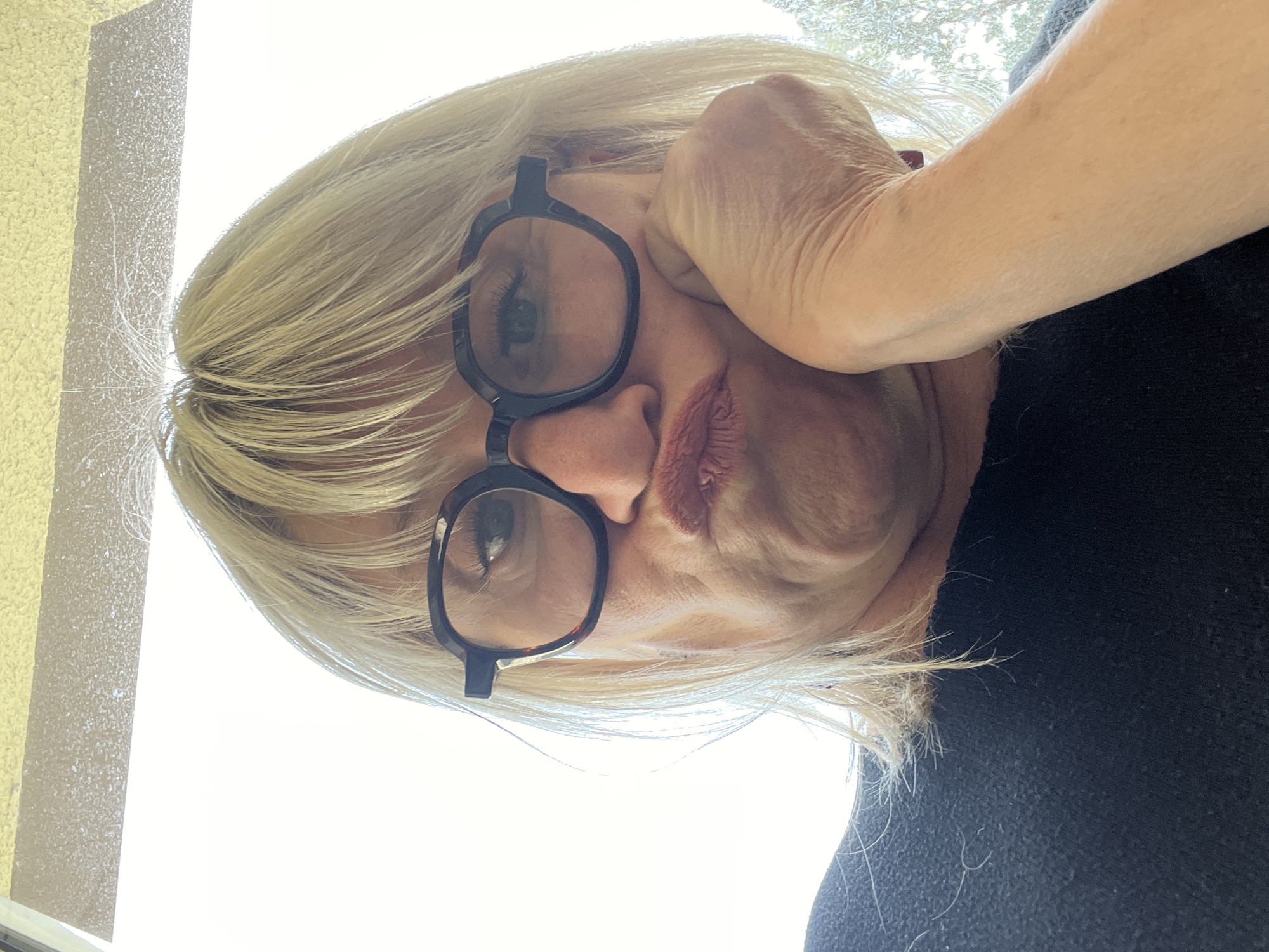 Woman captured in contemplative moment in La Fouillouse