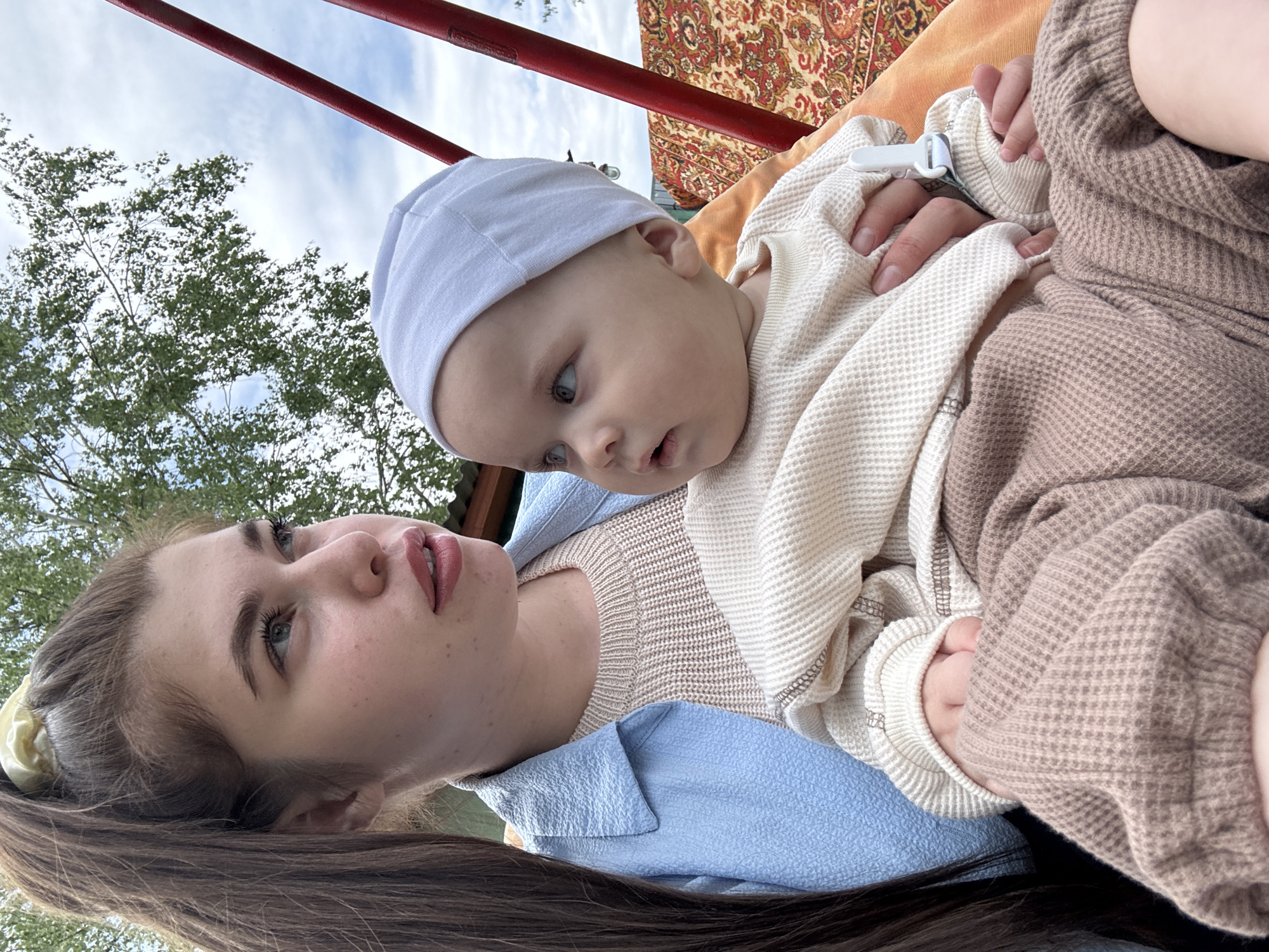 Family gathering with baby and dogs photographed in rural Russia