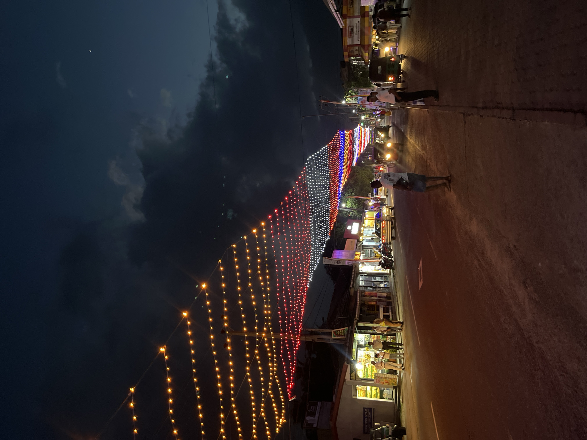 Habaraduwa lit up for a festive street celebration at dusk