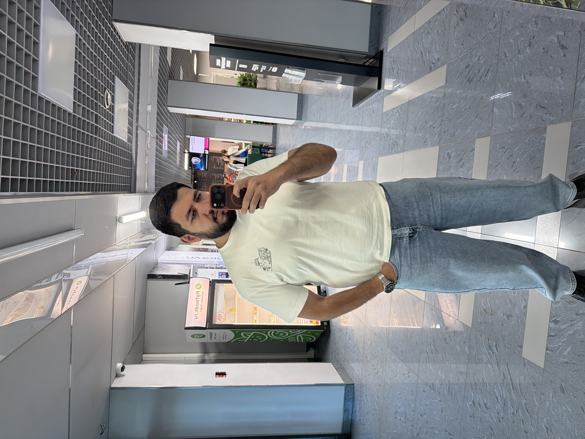 Man takes selfie in modern building in Krasnoyarsk