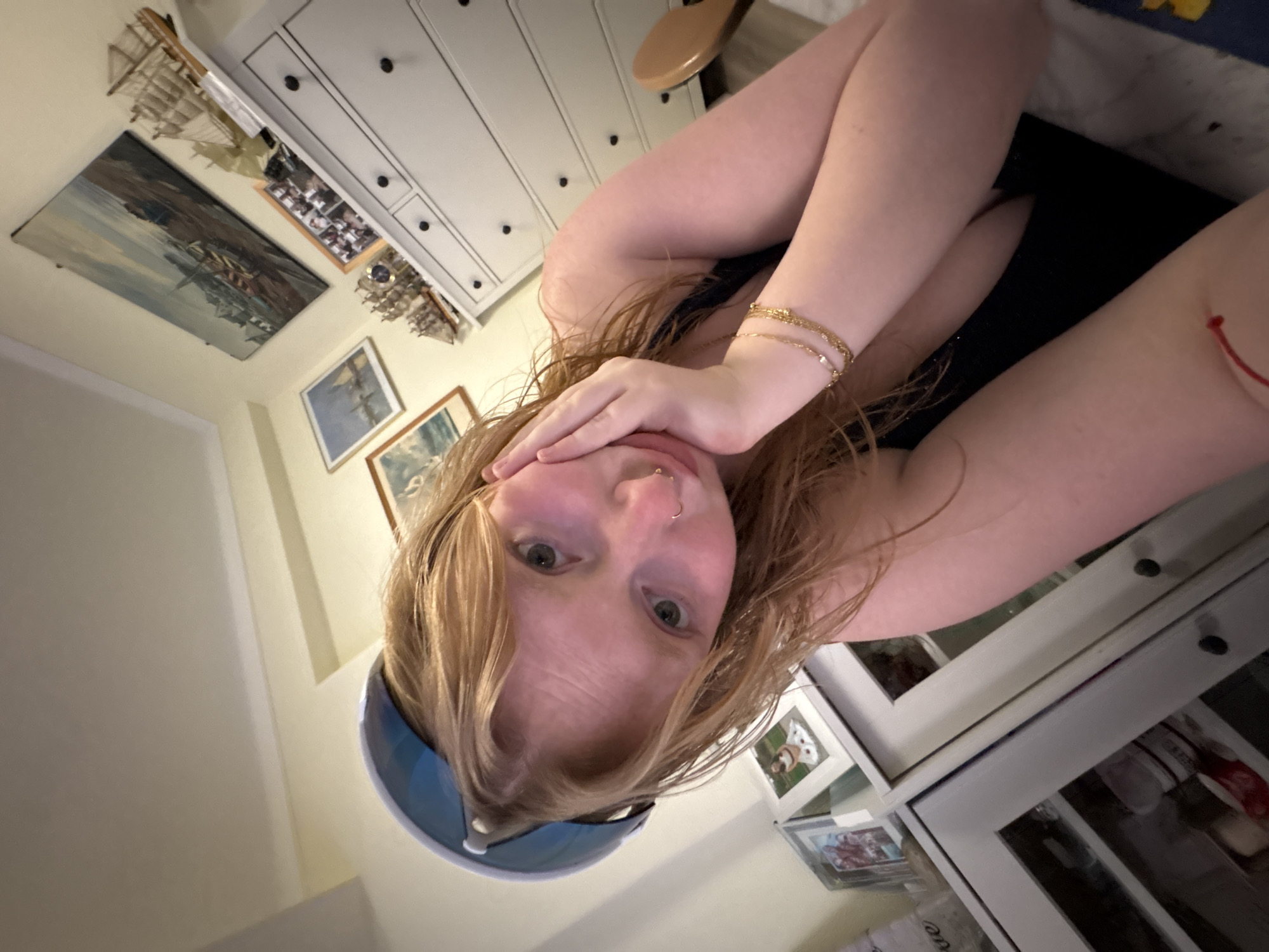 Friends gather for casual photo session in residential kitchen