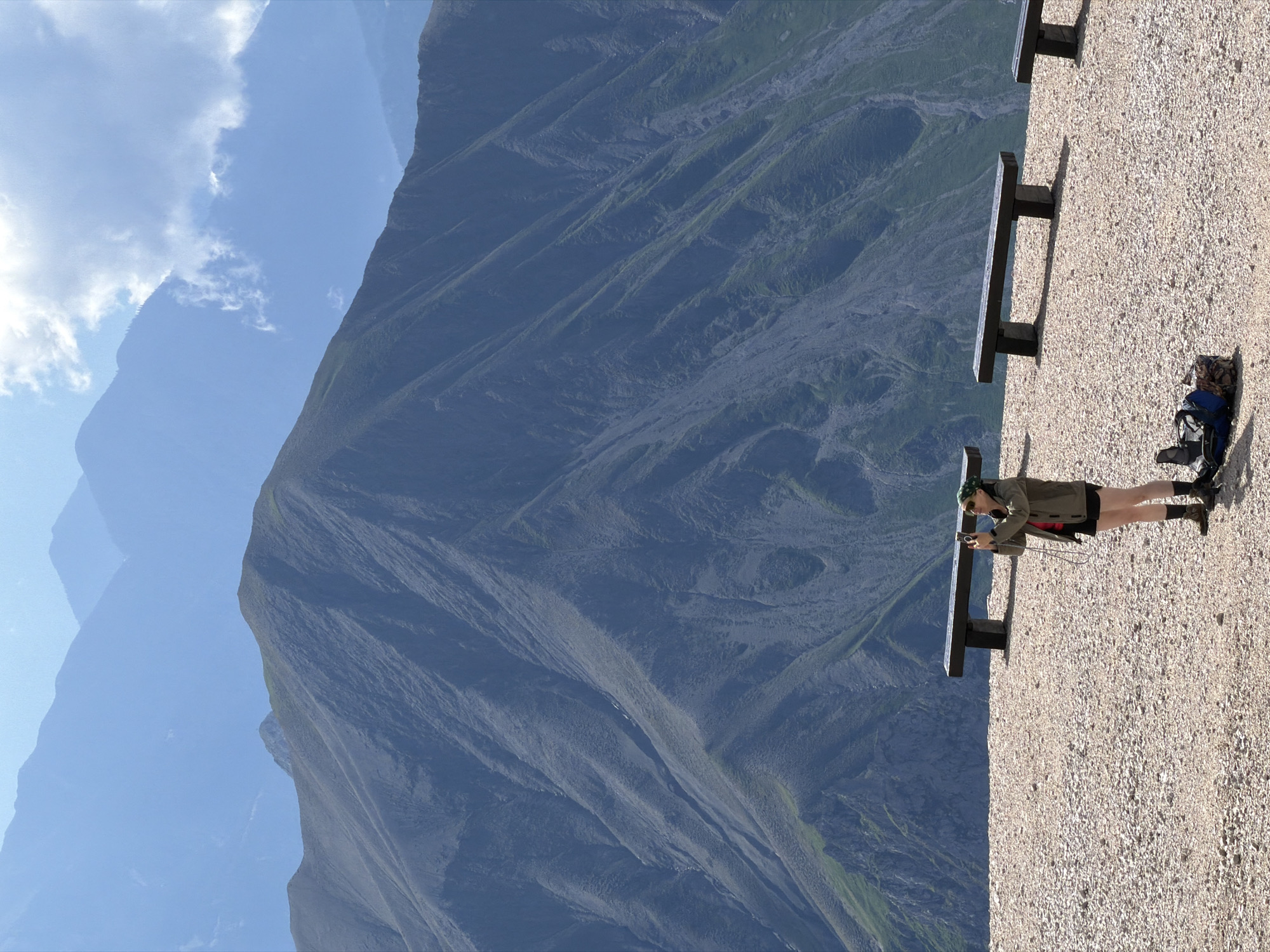 Hikers ascending a steep scree slope in the Austrian Alps
