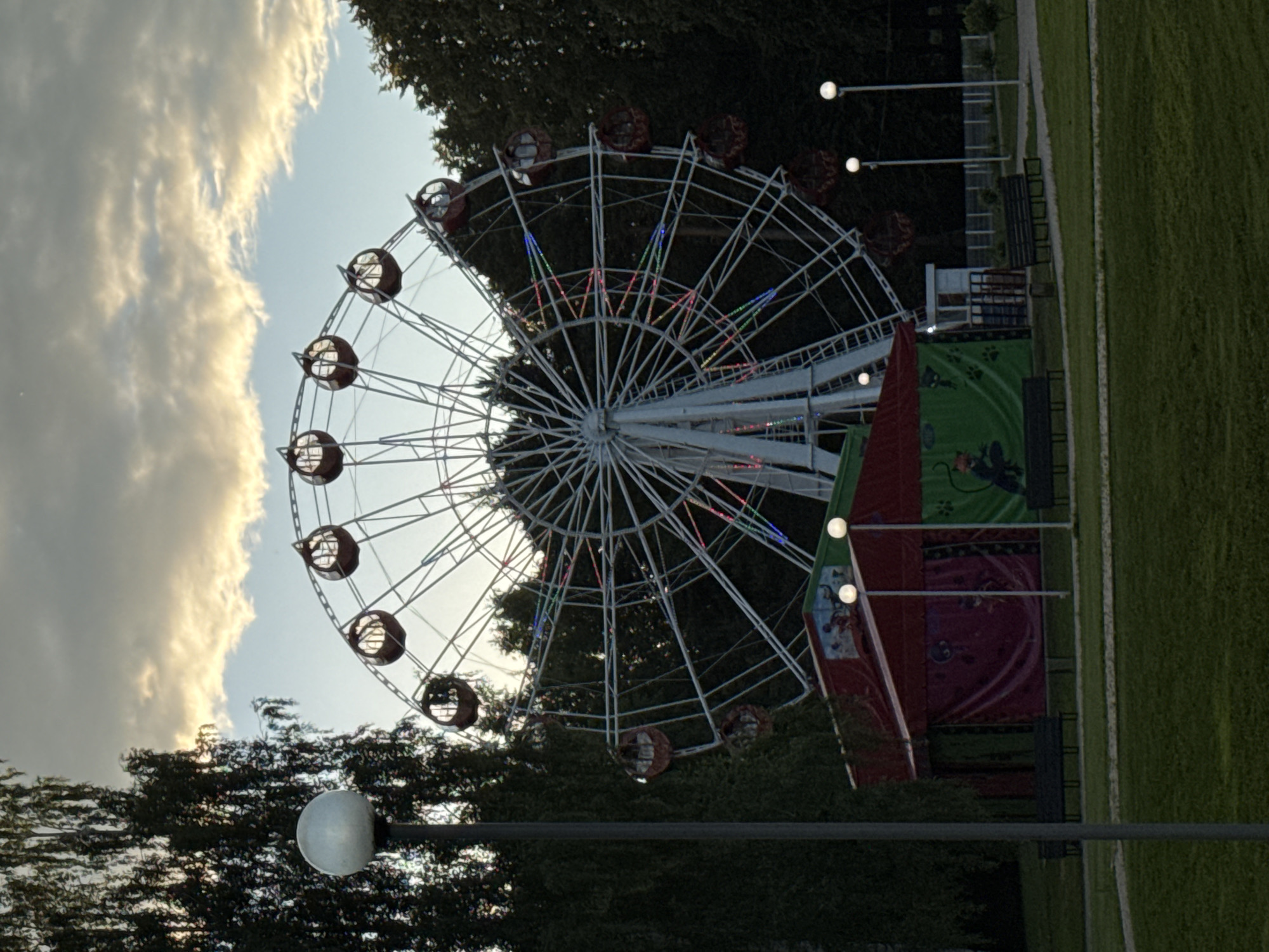 Ferris wheel and flying saucer ride at Izhevsk amusement park