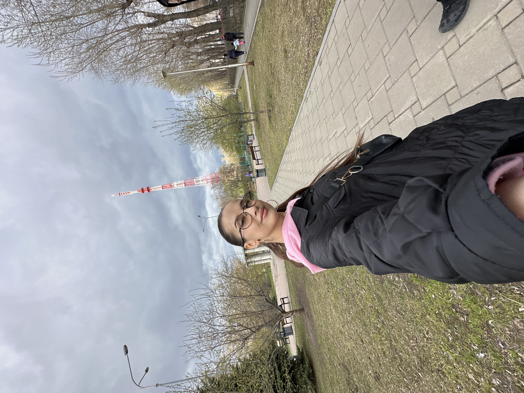 Woman photographs herself at classical monument in Yekaterinburg park