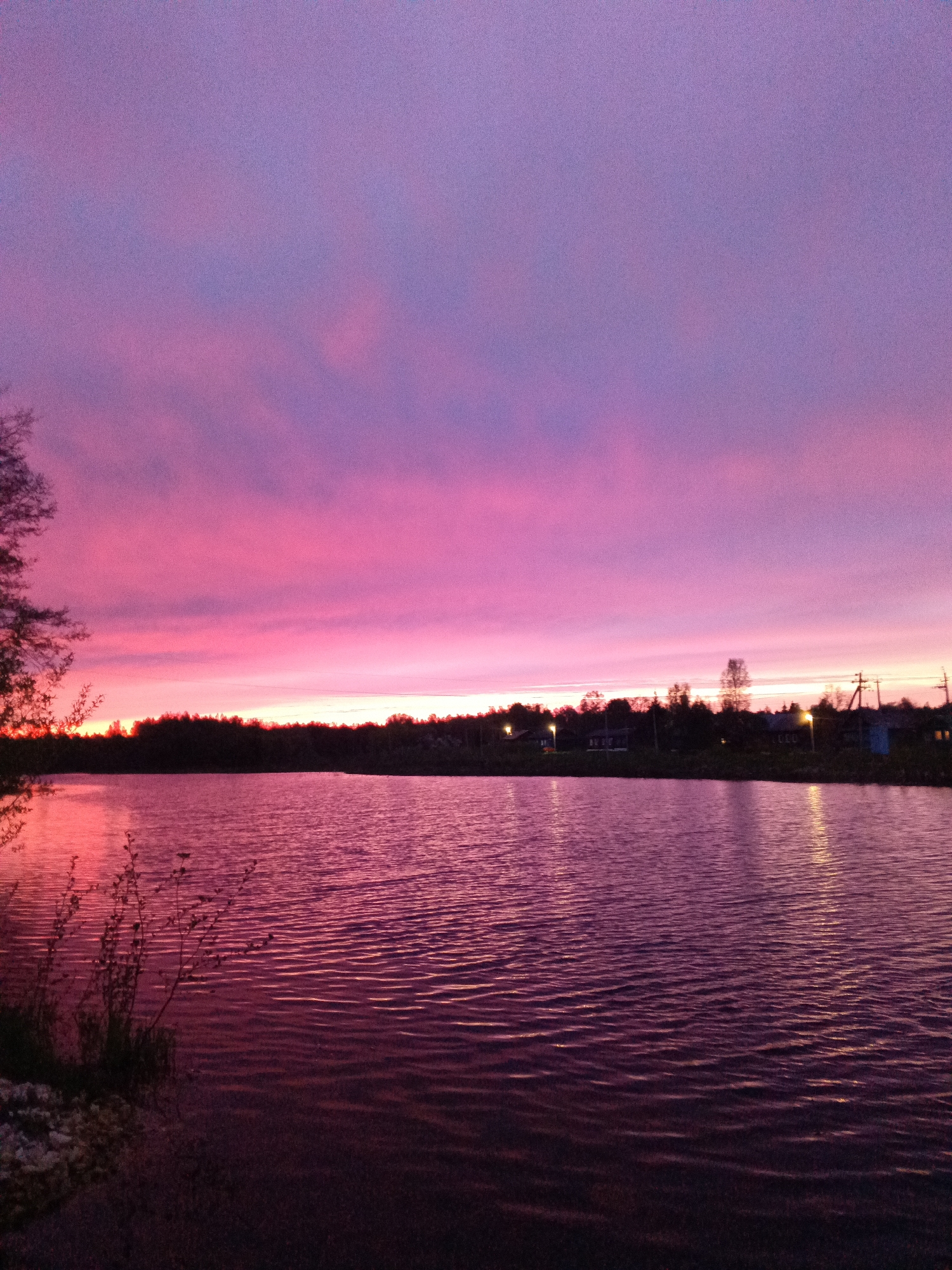 Pink and purple sunset observed over water in Красный Маяк