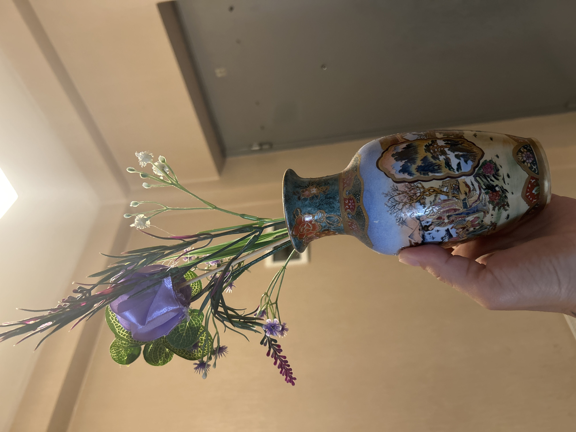 Person Documents Art Collection and Decorative Objects Over Morning Hours