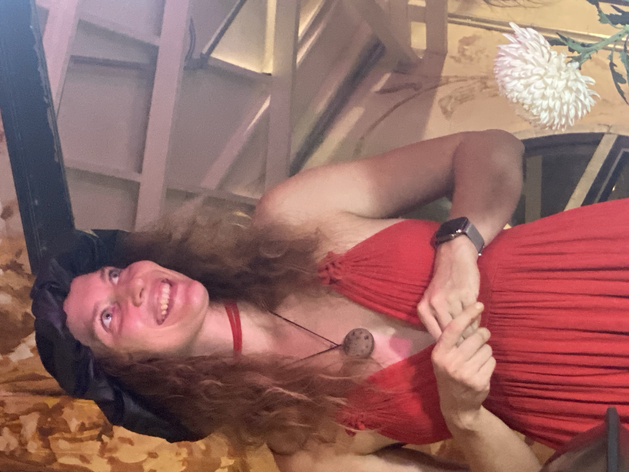 Live vocal performance in an eclectic, mural-filled indoor venue